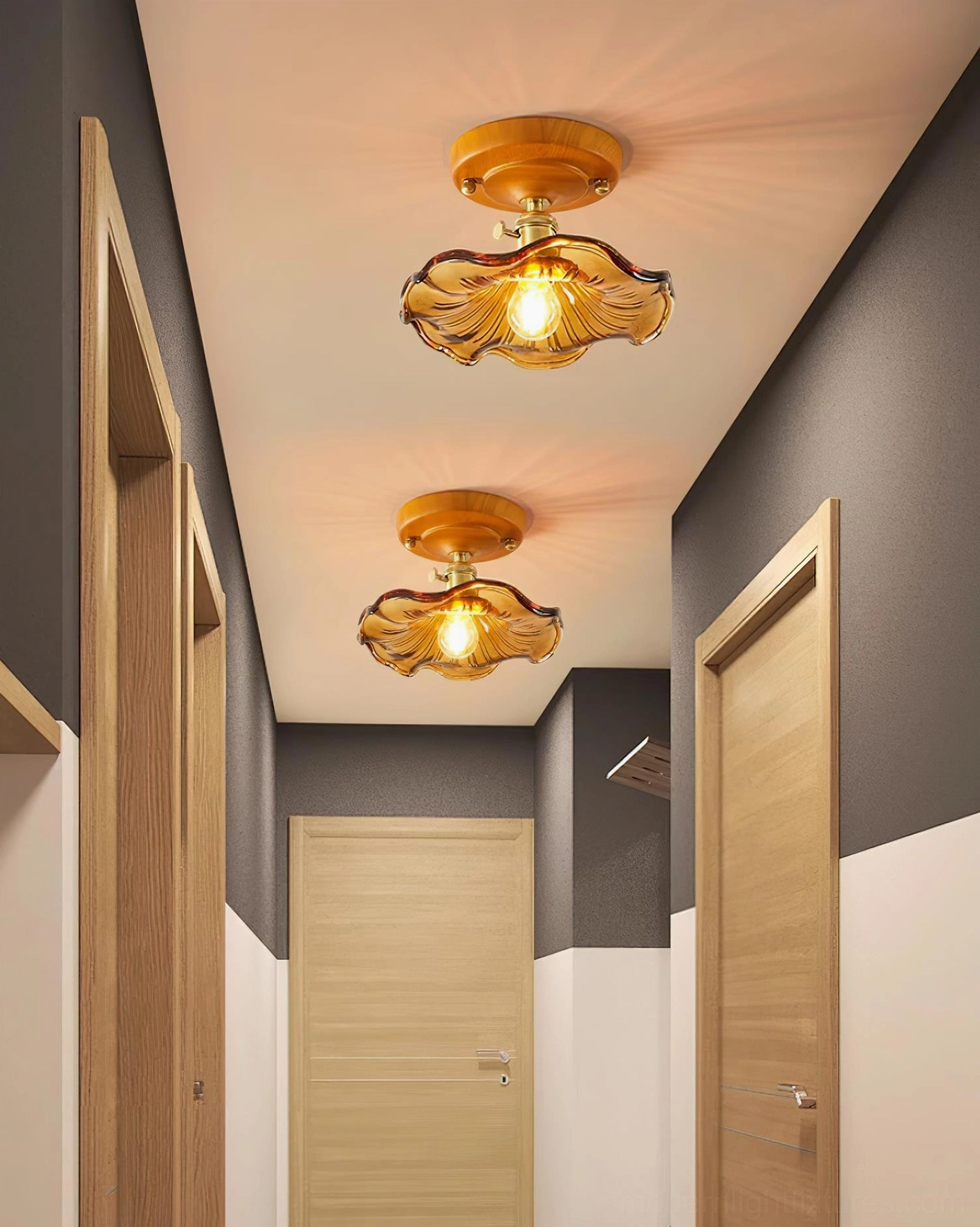 Modern flush mount ceiling light with amber textured glass and brass hardware detail view