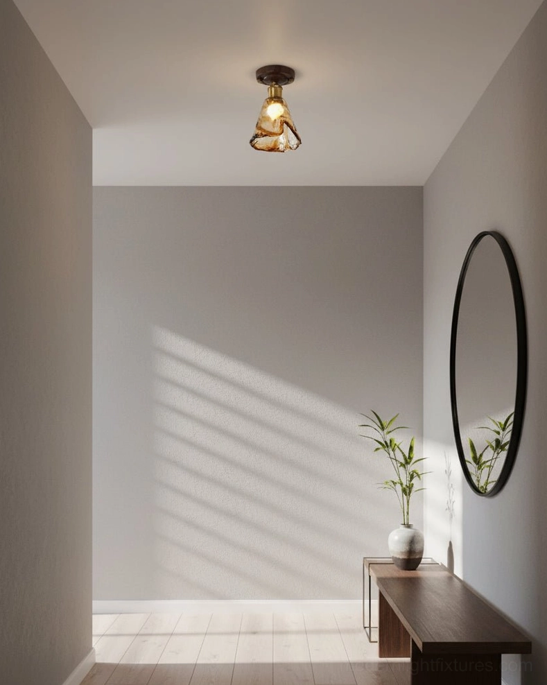 Amber glass flush mount ceiling light with molten texture shade and walnut wood base - detailed product photography