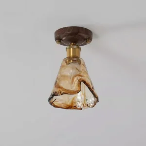 Amber glass ceiling fixture side perspective displaying twisted wavy glass lampshade with dark walnut wood ceiling mount canopy