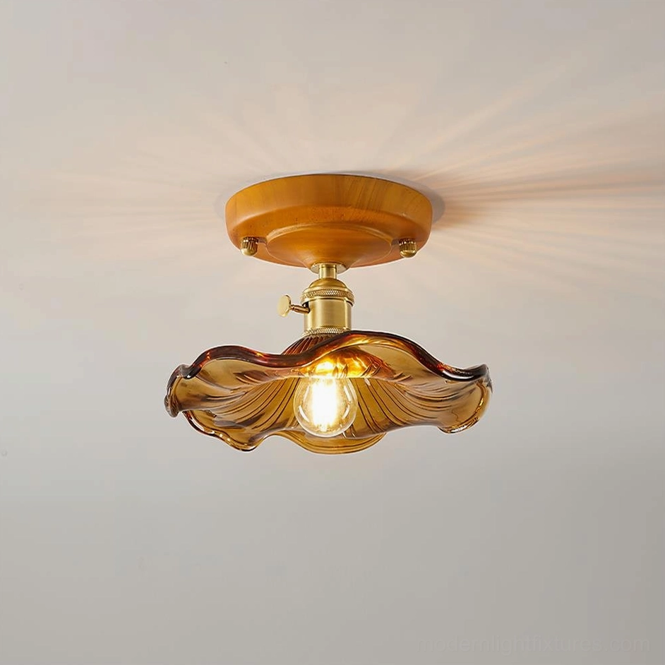 Warm amber textured glass ceiling light fixture styled with vintage home décor accessories