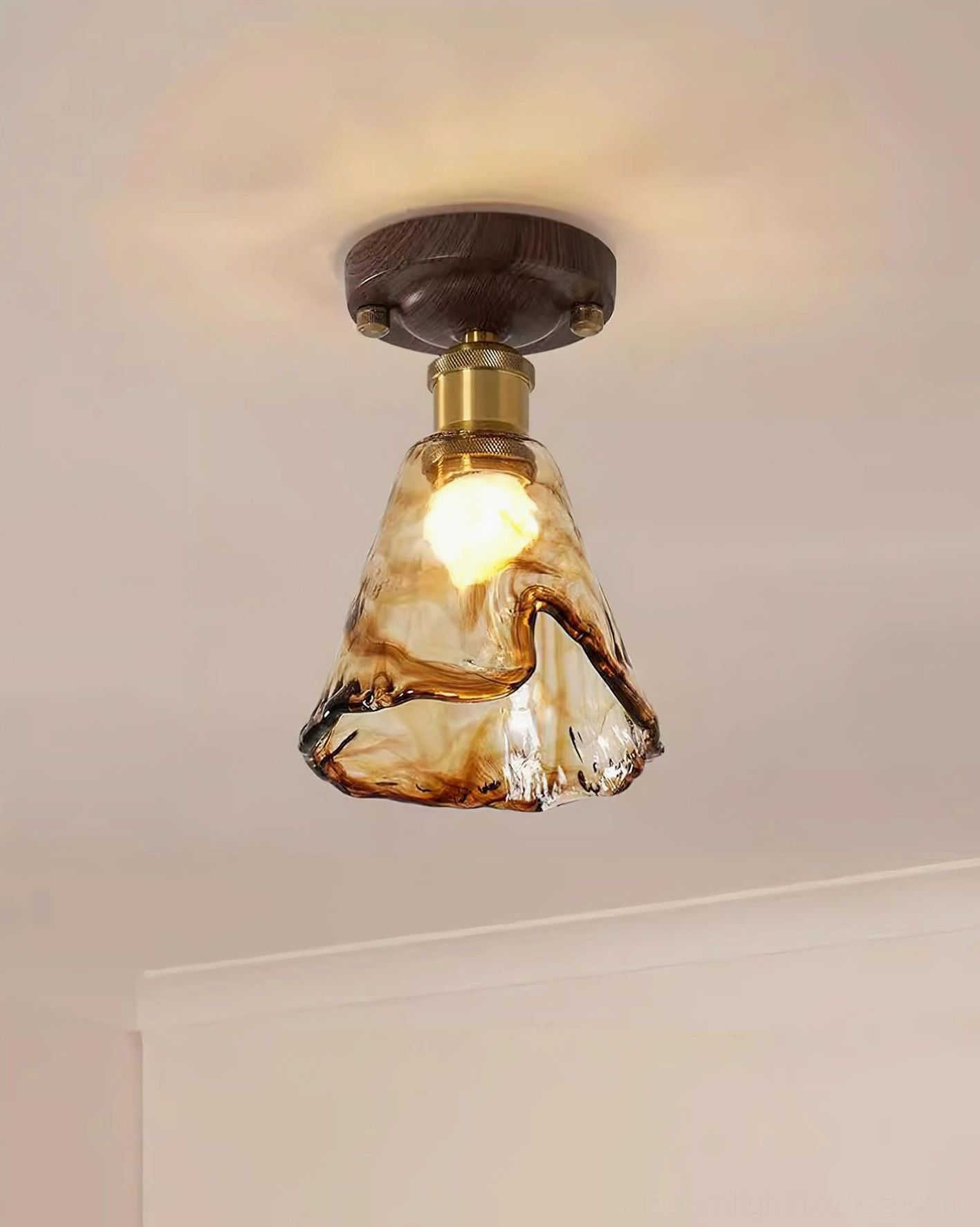Amber glass ceiling light with walnut wood canopy - installation detail showing ceiling mount connection
