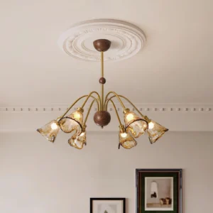 Amber chandelier installed in French-style living room with ceiling medallion creating warm vintage ambiance
