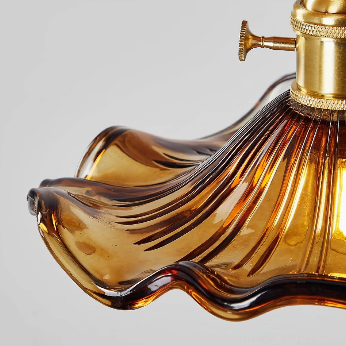 Complete amber ruffled glass ceiling fixture showcasing wavy glass design and wood base