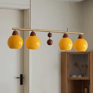 Mid-century modern amber glass pendant light installed in residential entryway with warm retro styling