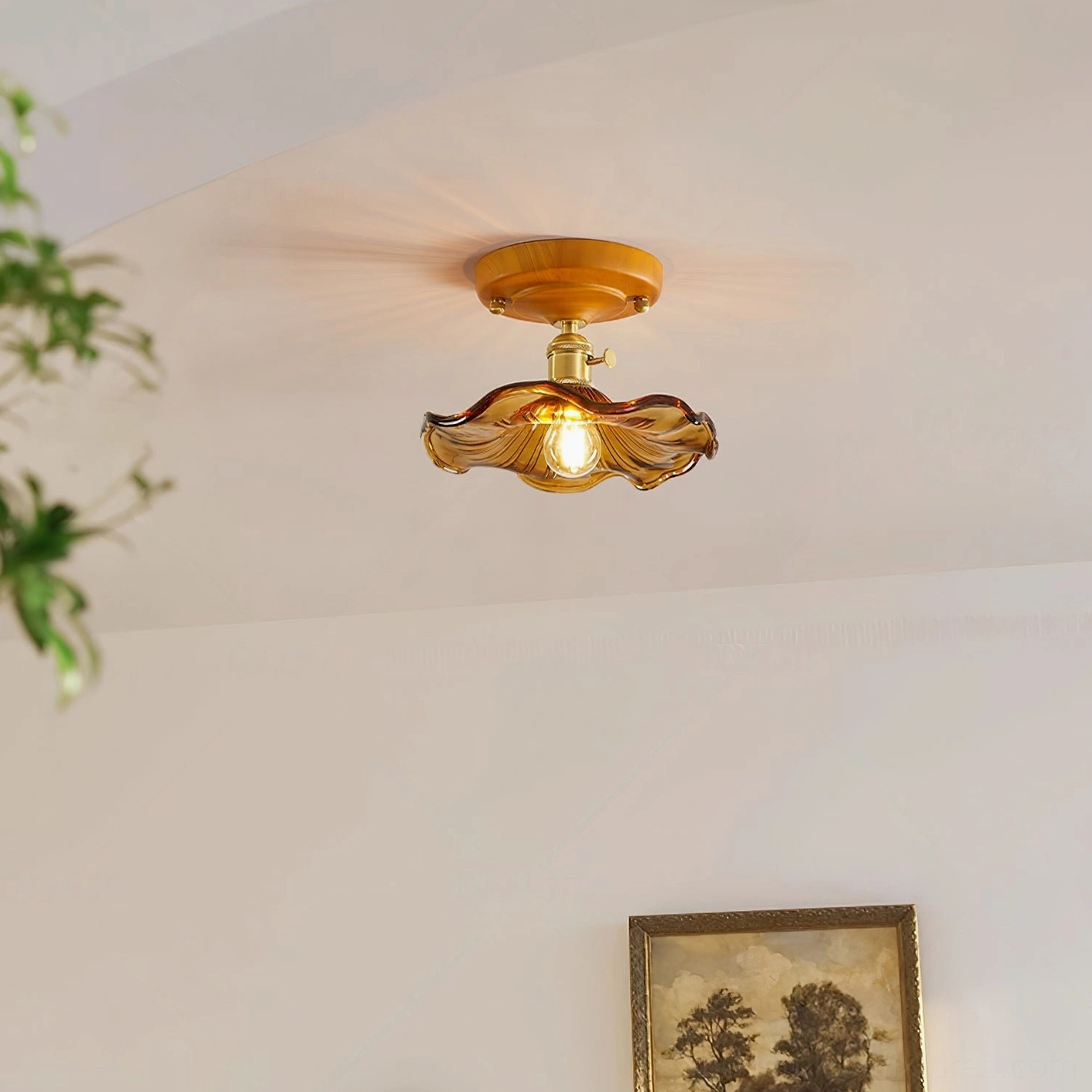 Modern vintage flush mount ceiling light with amber rippled glass shade mounted in residential entryway