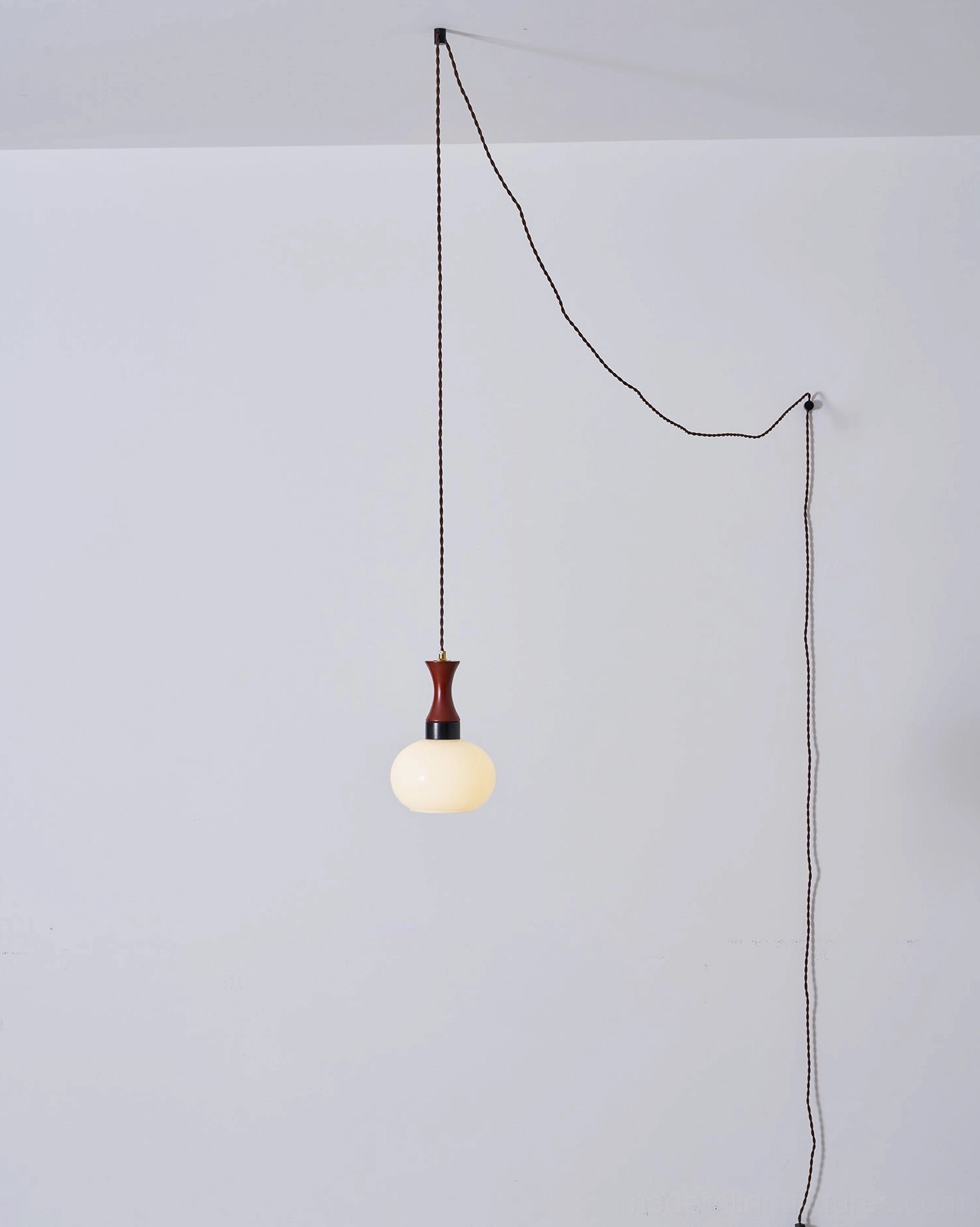 Warm amber glass pendant fixture bringing mid-century charm to modern homes