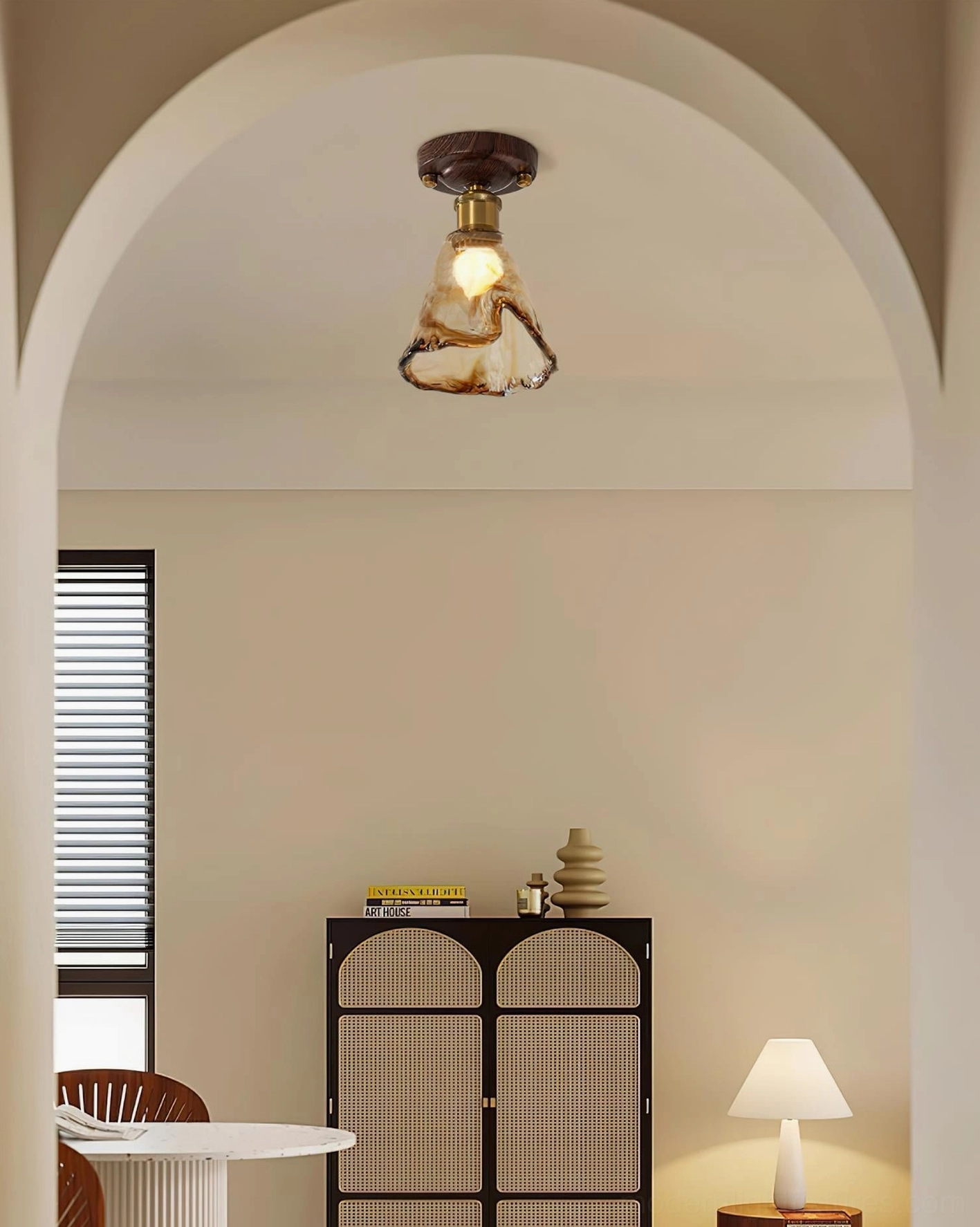 Molten texture amber glass shade of ceiling fixture highlighting hand-finished craftsmanship - close-up photography