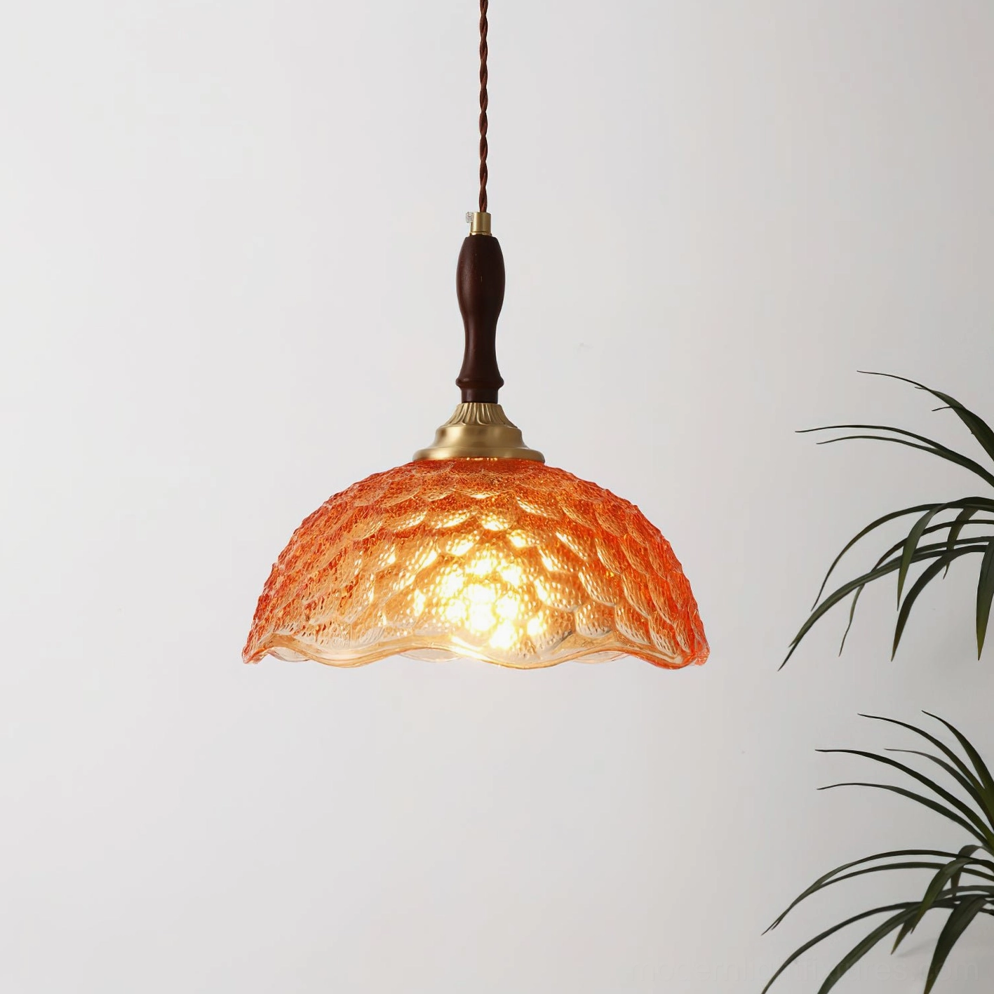 Amber orange scalloped glass pendant lamp with retro wood-brass finish, warm textured dome shade indoor