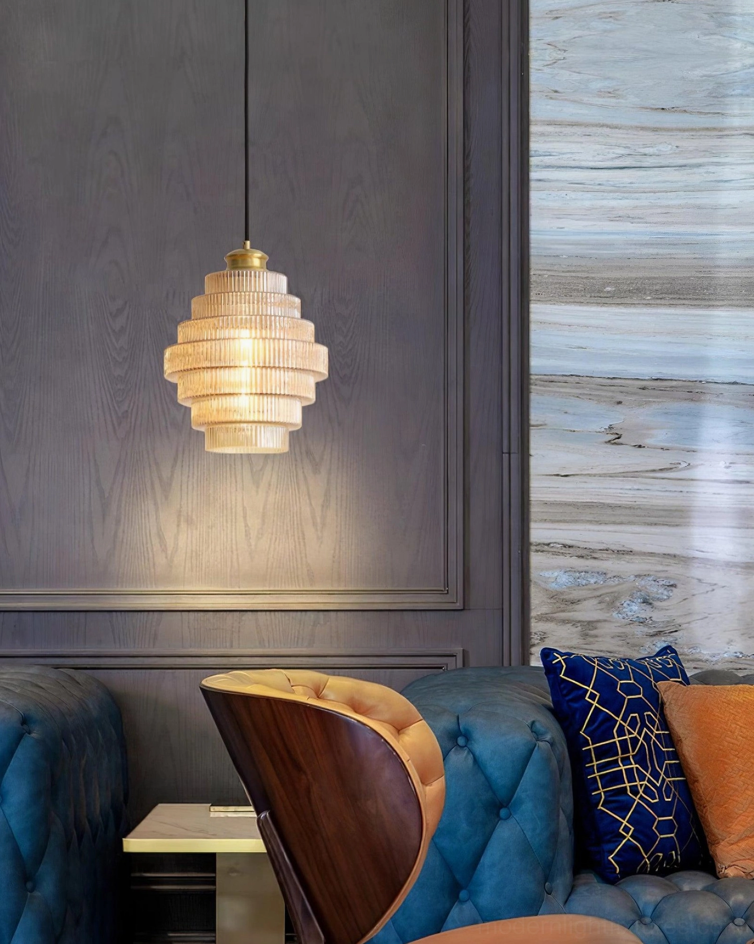 Amber ridged glass pendant light casting refracted patterns, architectural lighting effect