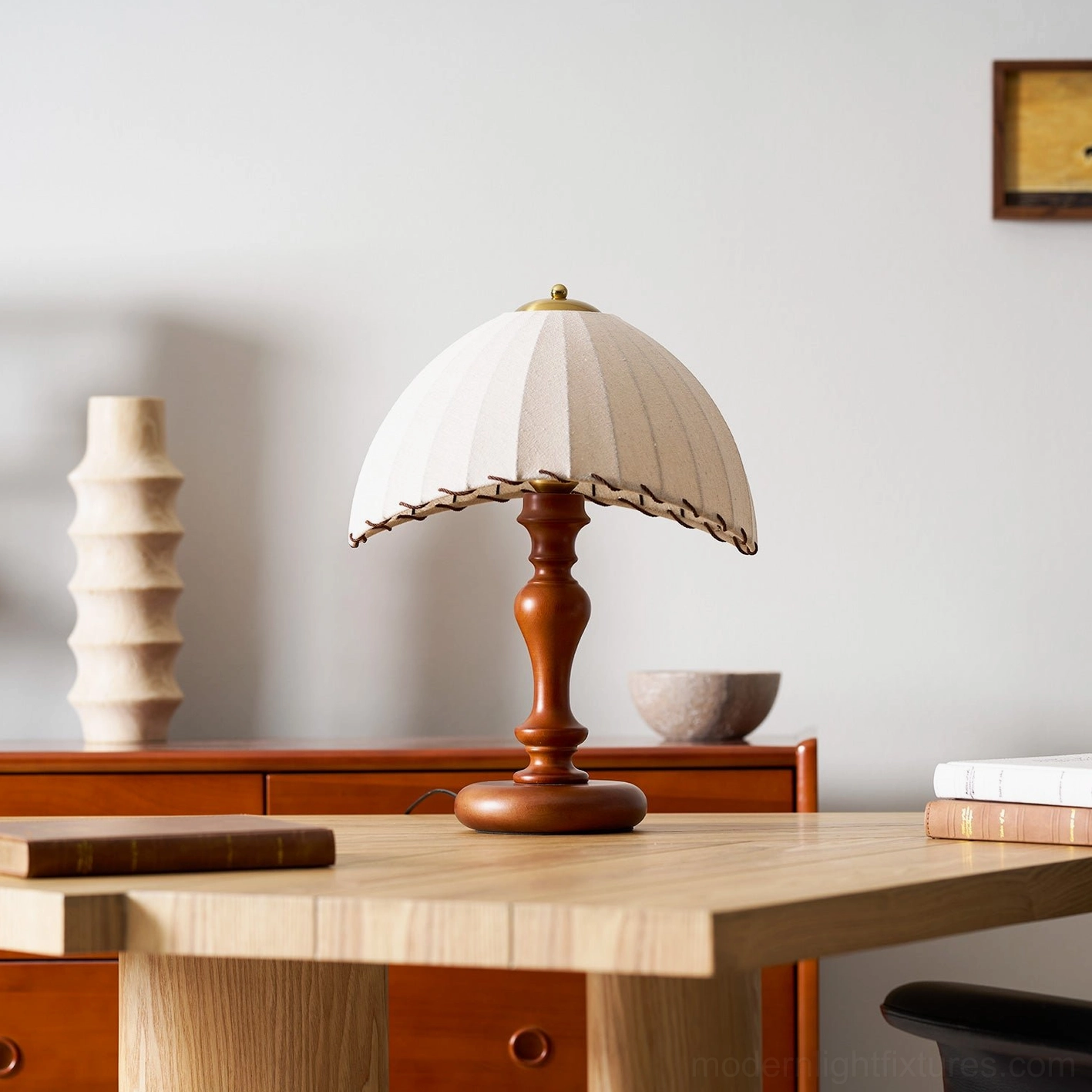 Warm ambient lighting from pleated table lamp, soft diffused glow in interior space