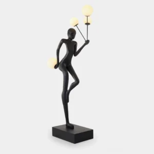 Amelia sculptural floor lamp with matte black resin body and frosted globe lights, front studio view