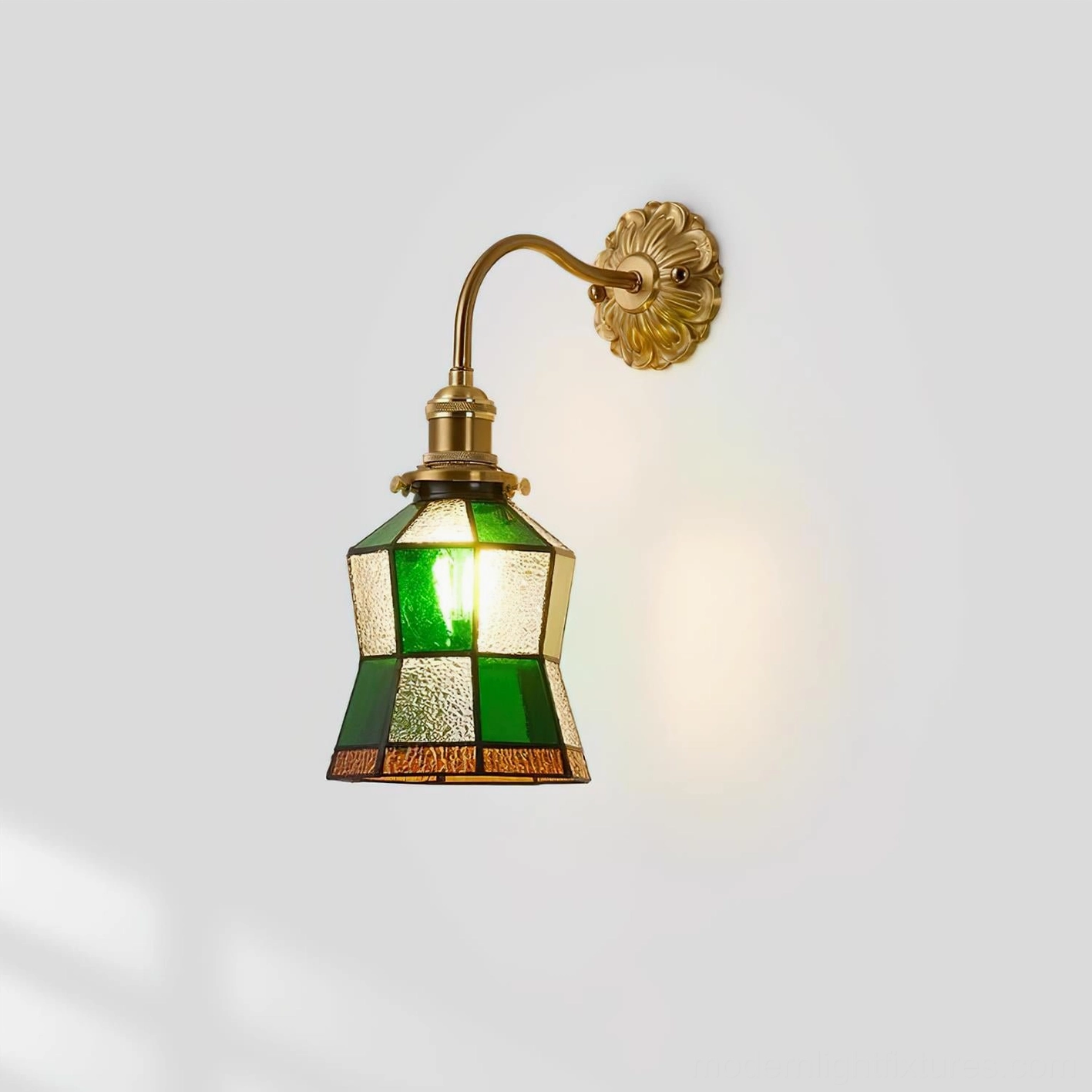 American retro vintage stained glass wall lamp with patchwork glass design shown from left front angle against white studio background