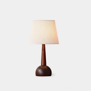 Amire mid-century modern wooden table lamp with pleated fabric shade, walnut base, studio frontal view