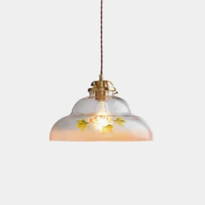 Amorine vintage brass pendant light with hand-painted floral glass shade, brass hardware and twisted cord detail in studio view