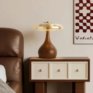 Andi glass table lamp styled on living room side table next to leather sofa and wooden nightstand
