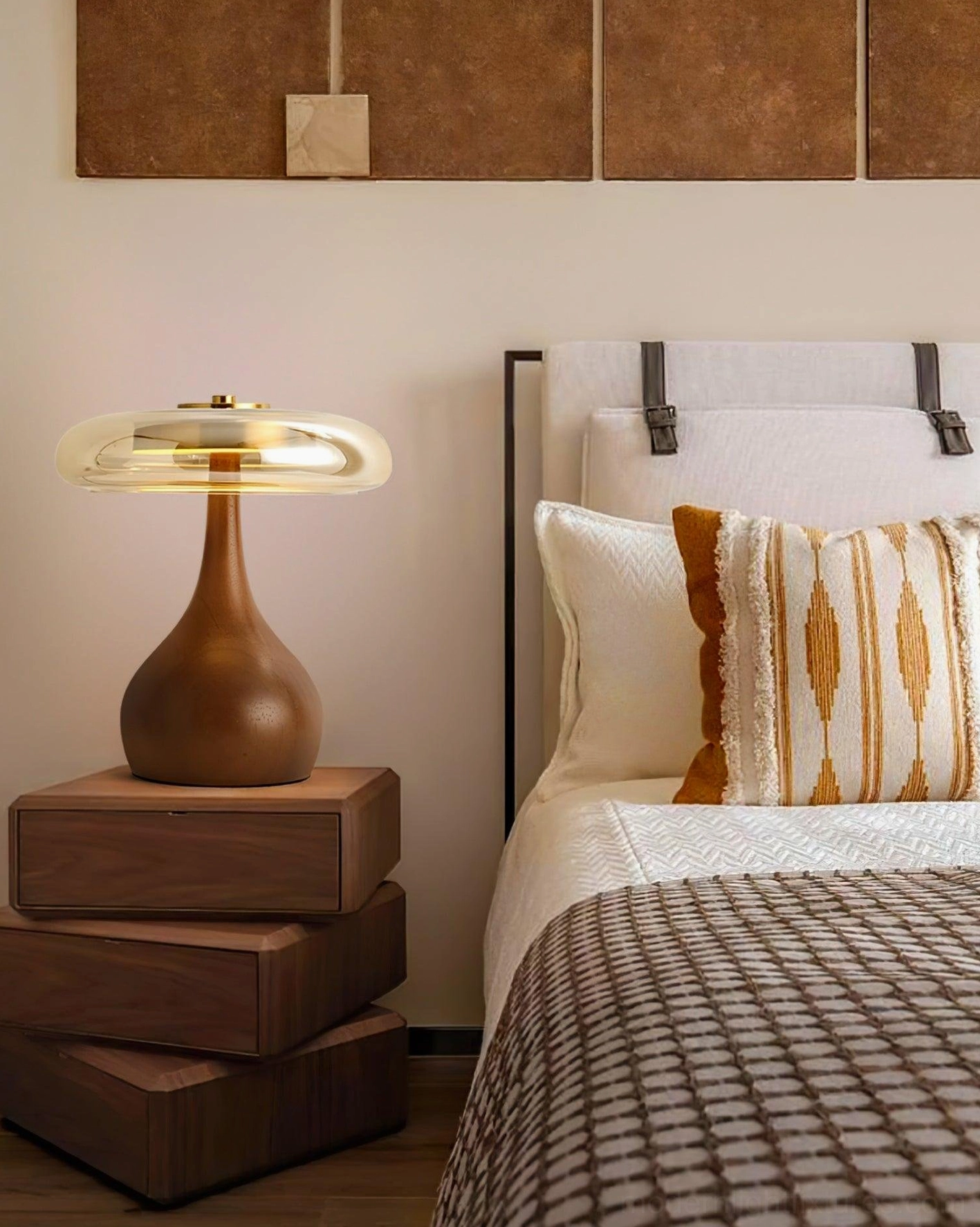 Andi modern table lamp on stacked wooden bedside tables with striped bedding