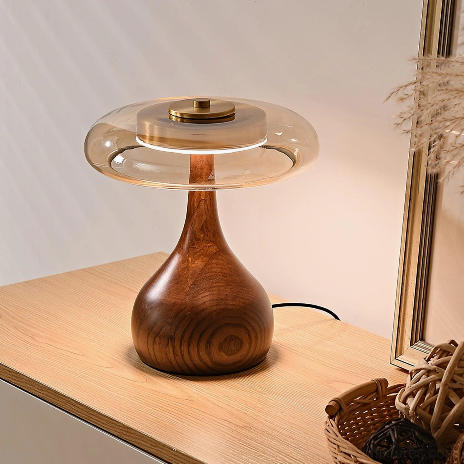 Andi glass lamp placed on bedroom vanity with mirror and boho home decor accessories
