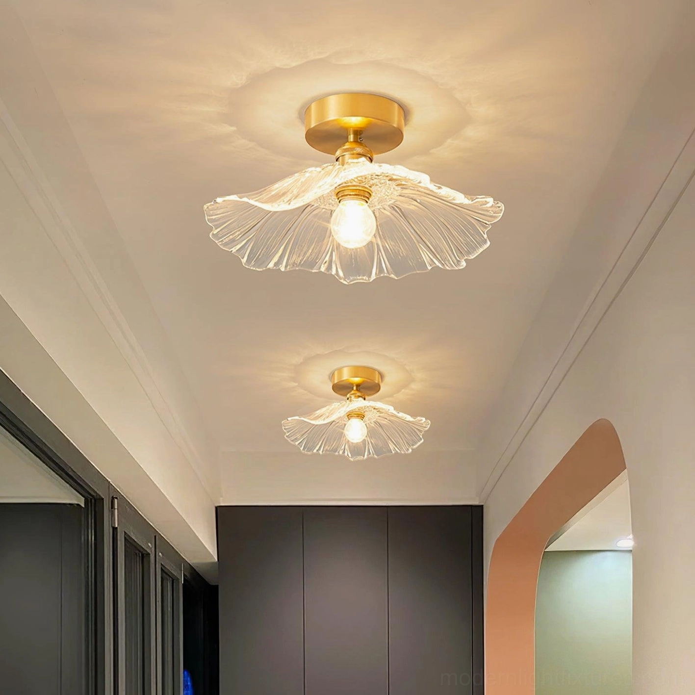 Angled view of ruffled glass ceiling light showing clear textured shade diffusing warm illumination in residential space