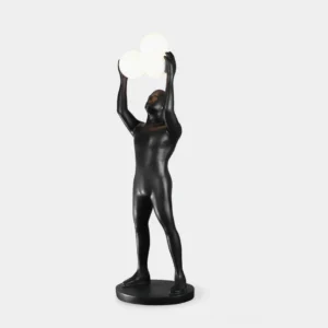 Anissa sculptural floor lamp front three-quarter view with matte black resin body and three frosted globe lights