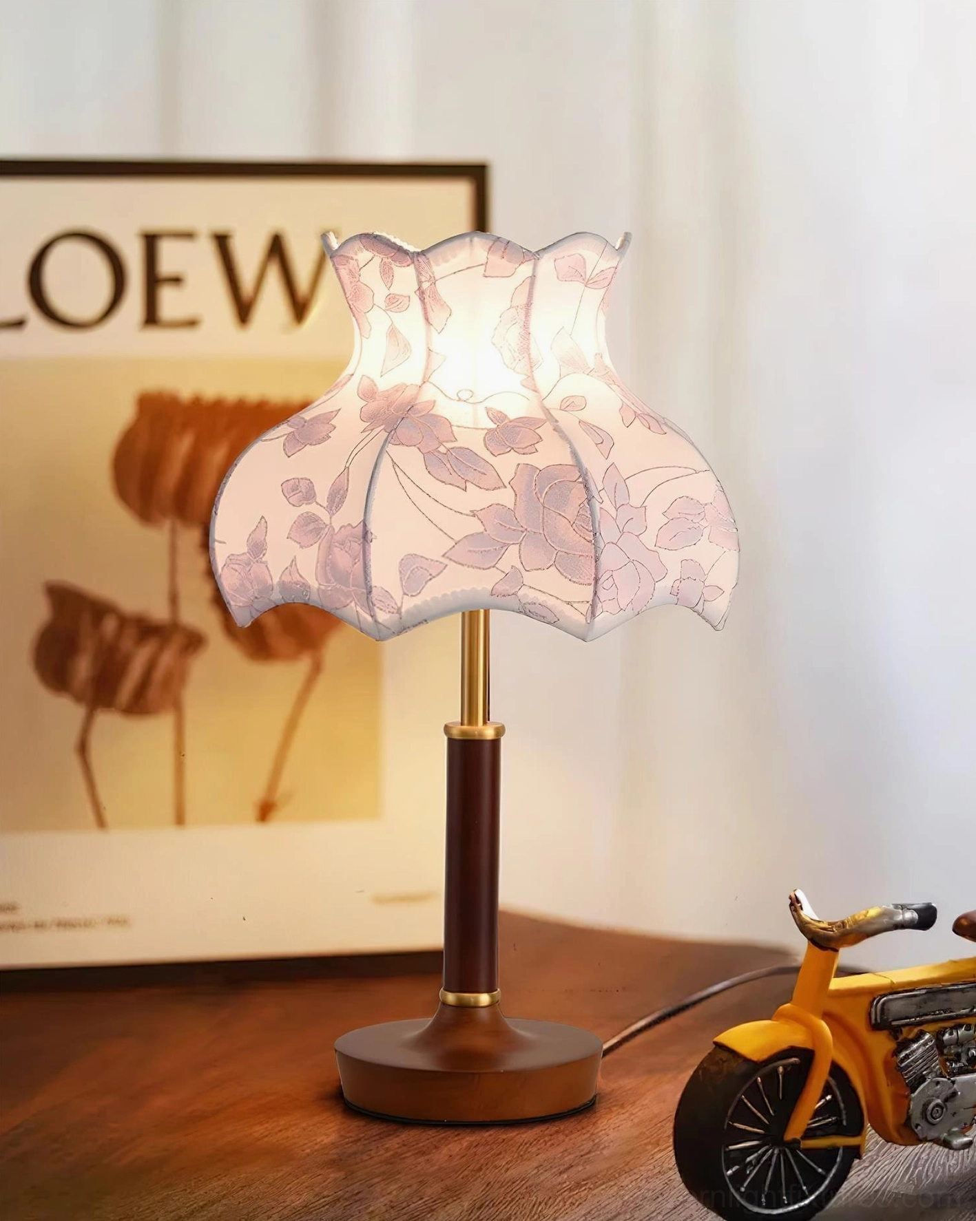 Antique style table lamp with scalloped shade on wooden desk, nostalgic retro home décor arrangement