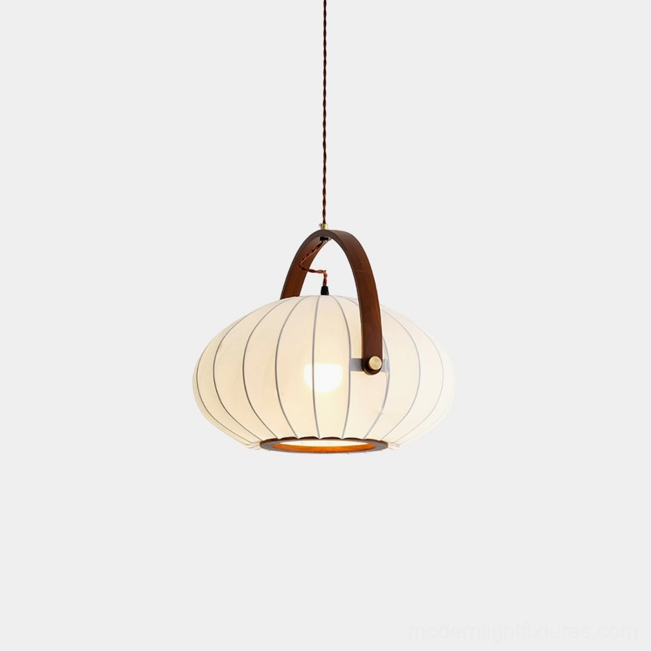 Antonio fabric pendant lamp with pleated white shade and walnut wood handle, overhead view on white background