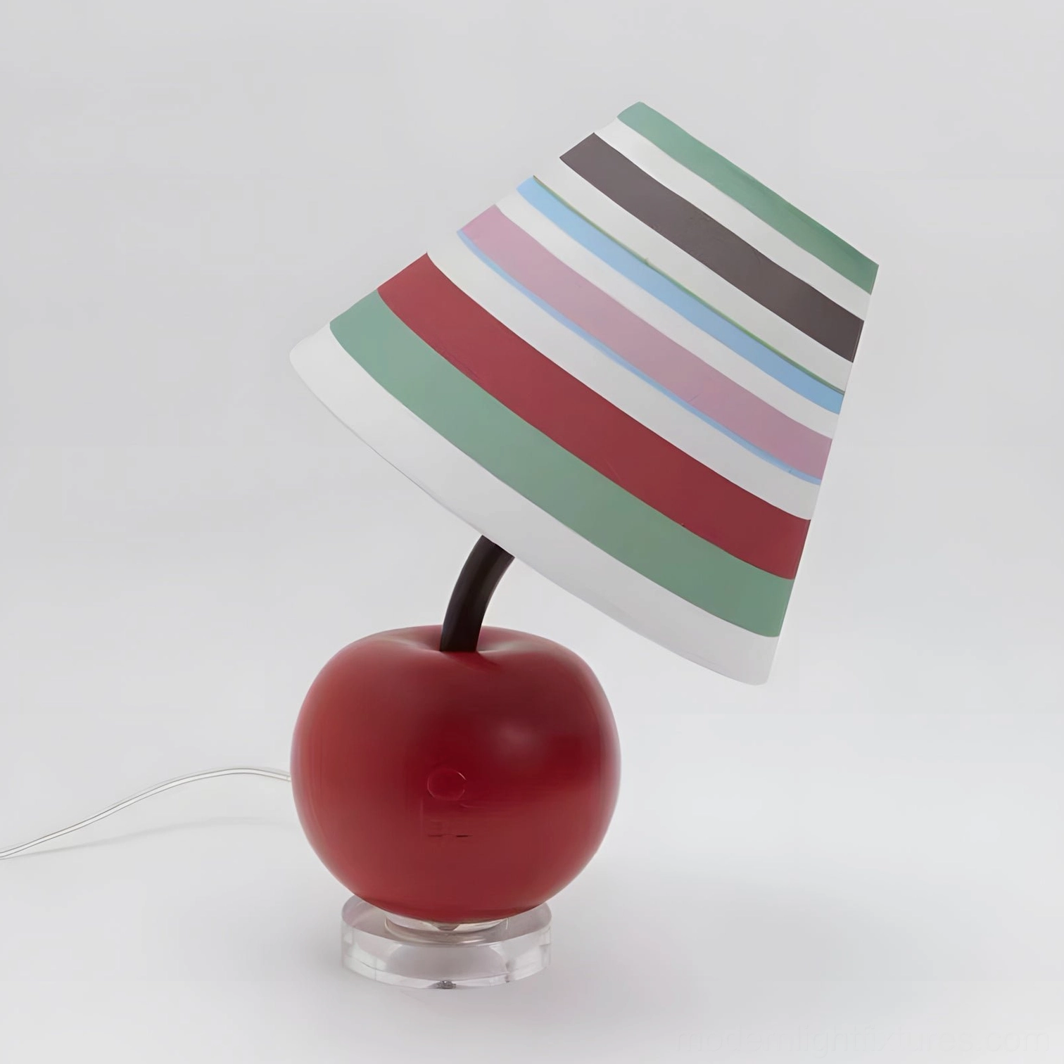 Red apple table lamp with multi-color striped fabric shade, left oblique studio view, contemporary design