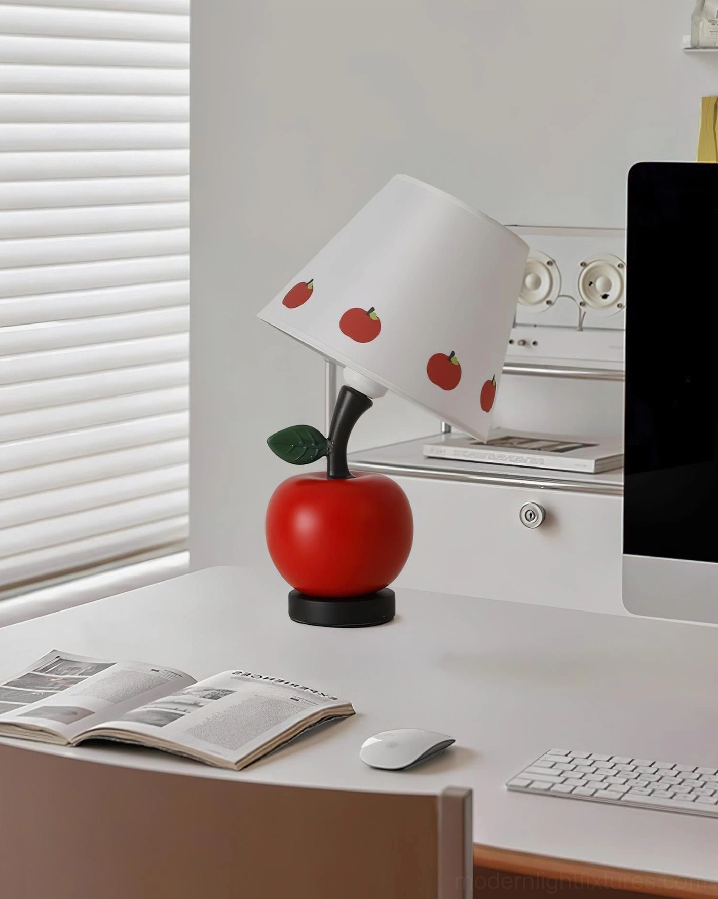 Apple-shaped table lamp on modern white office desk with computer keyboard and mouse setup