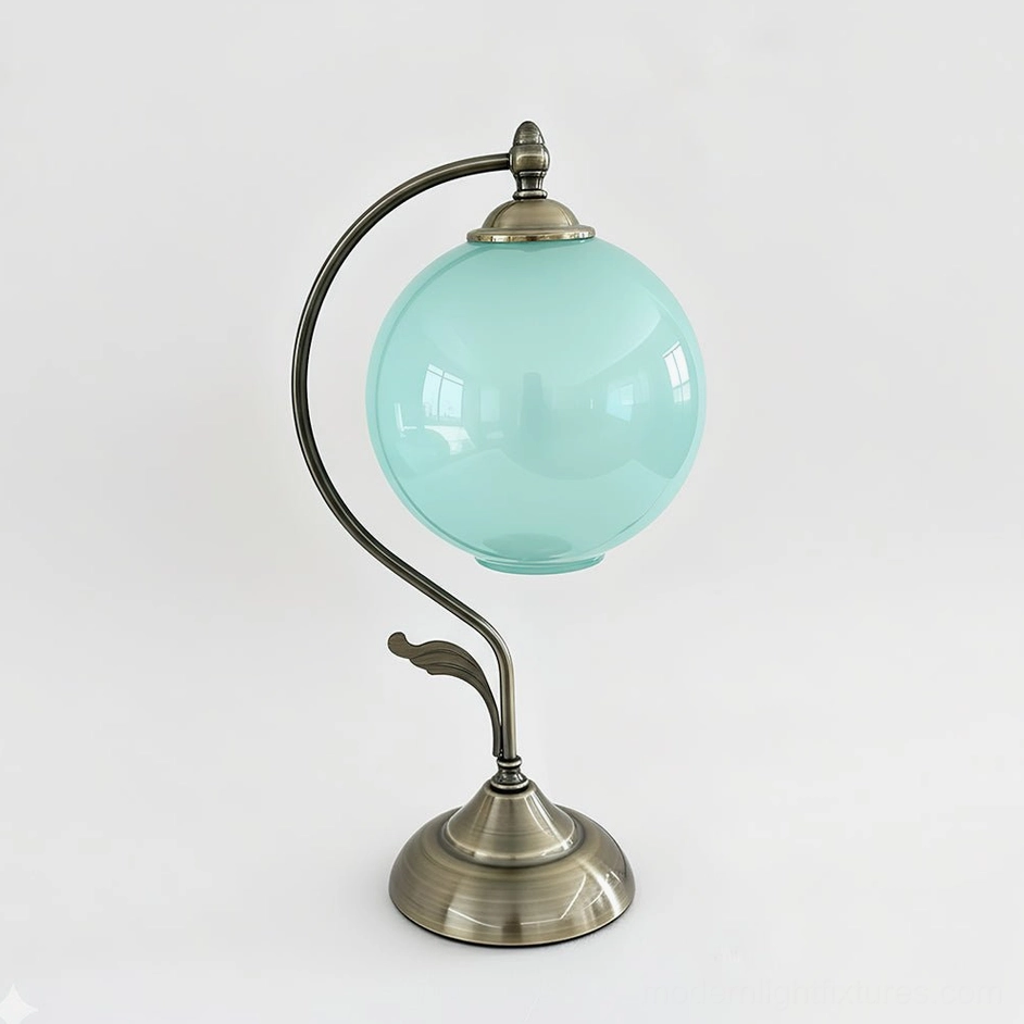 Aqua frosted globe table lamp with curved brass frame, serene blue-green color variant showing mid-century Scandinavian aesthetic