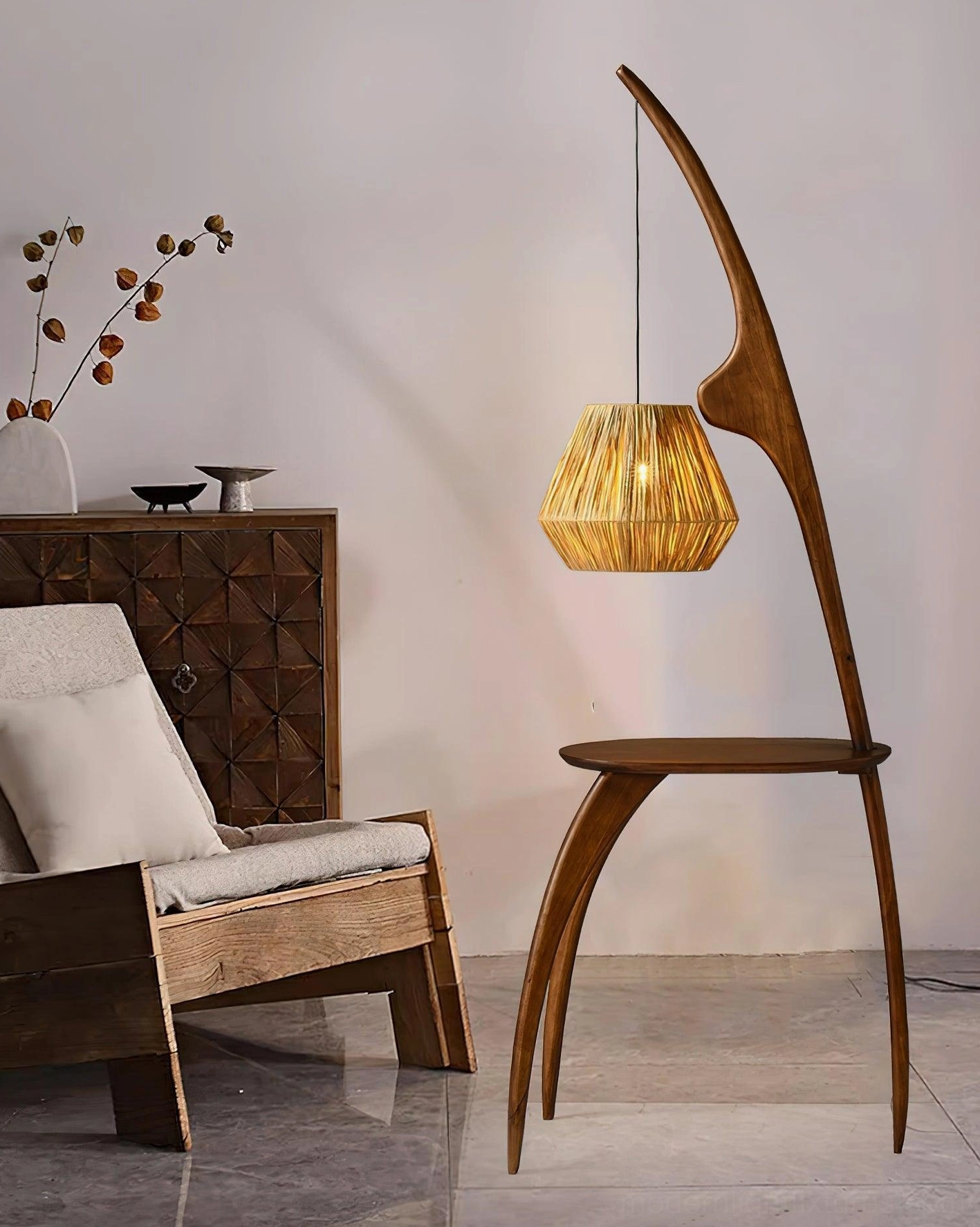 Japanese wabi-sabi inspired arc floor lamp in bedroom setting with wooden furniture and dried flowers