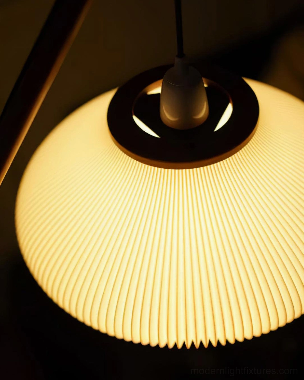 Black metal triangular base of mid-century arc floor lamp, structural foundation detail