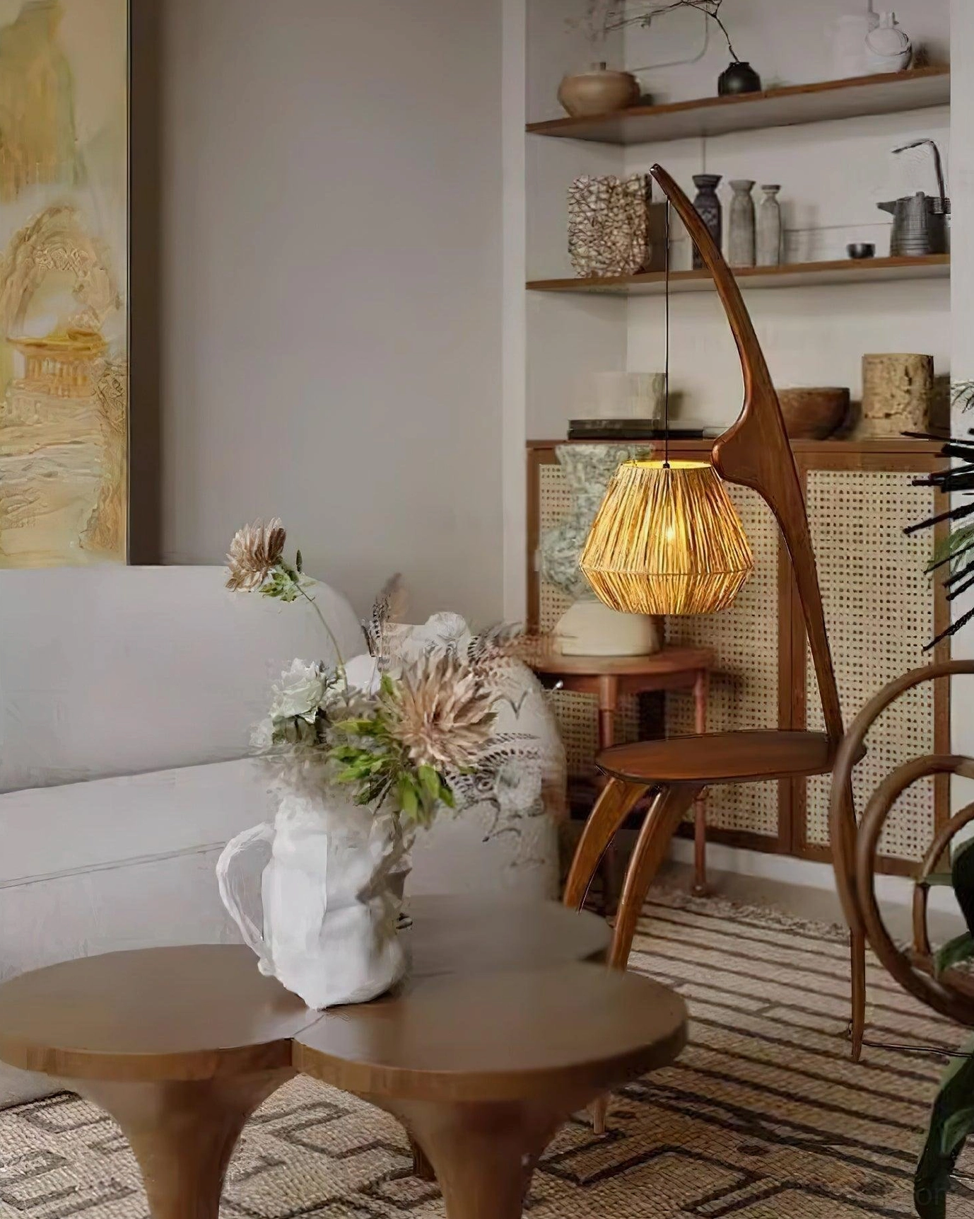 Arc floor lamp with rattan shade in bohemian living room with sofa, warm ambient lighting