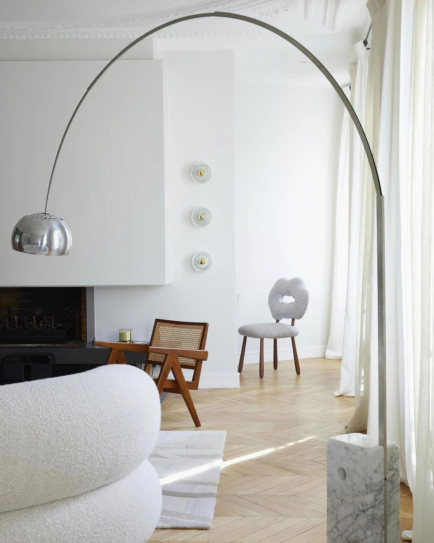 Contemporary arc floor lamp showing cable management and foot switch detail