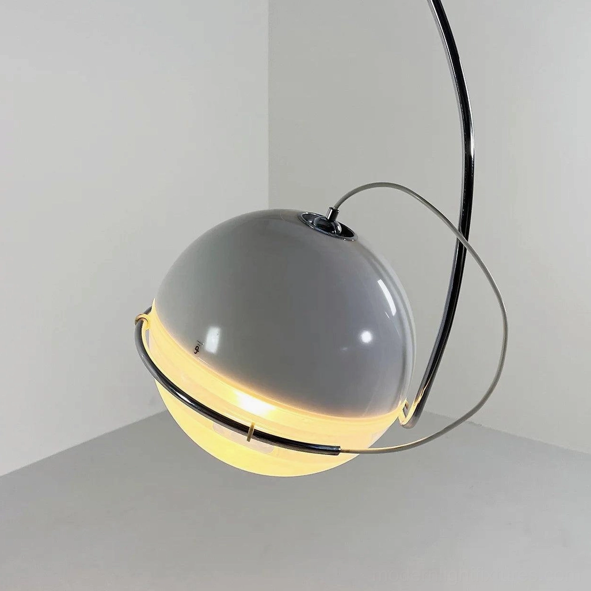 Arc floor lamp detail shot emphasizing contemporary minimalist design and premium metal construction