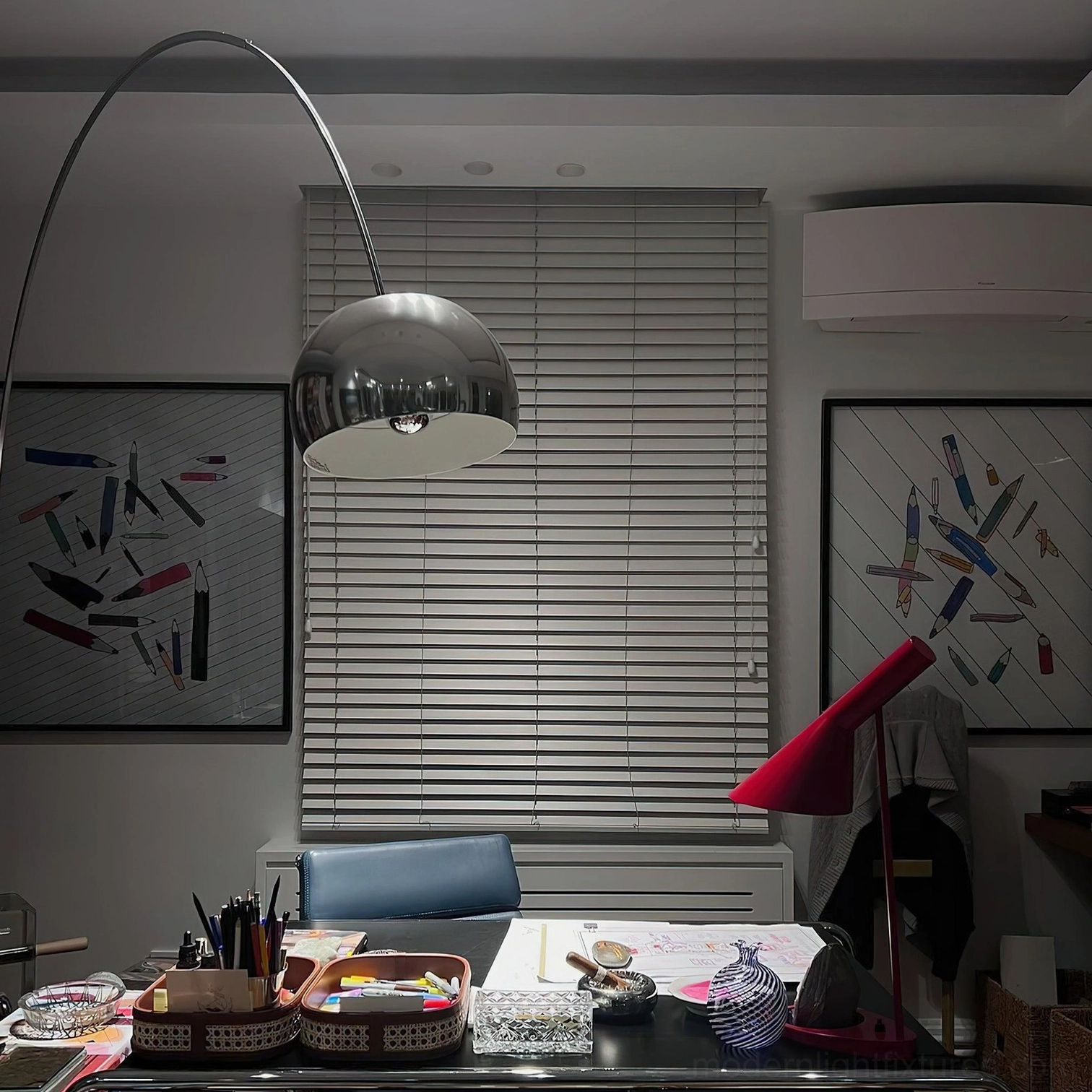 Arc floor lamp with curved metal arc and fabric shade in contemporary interior