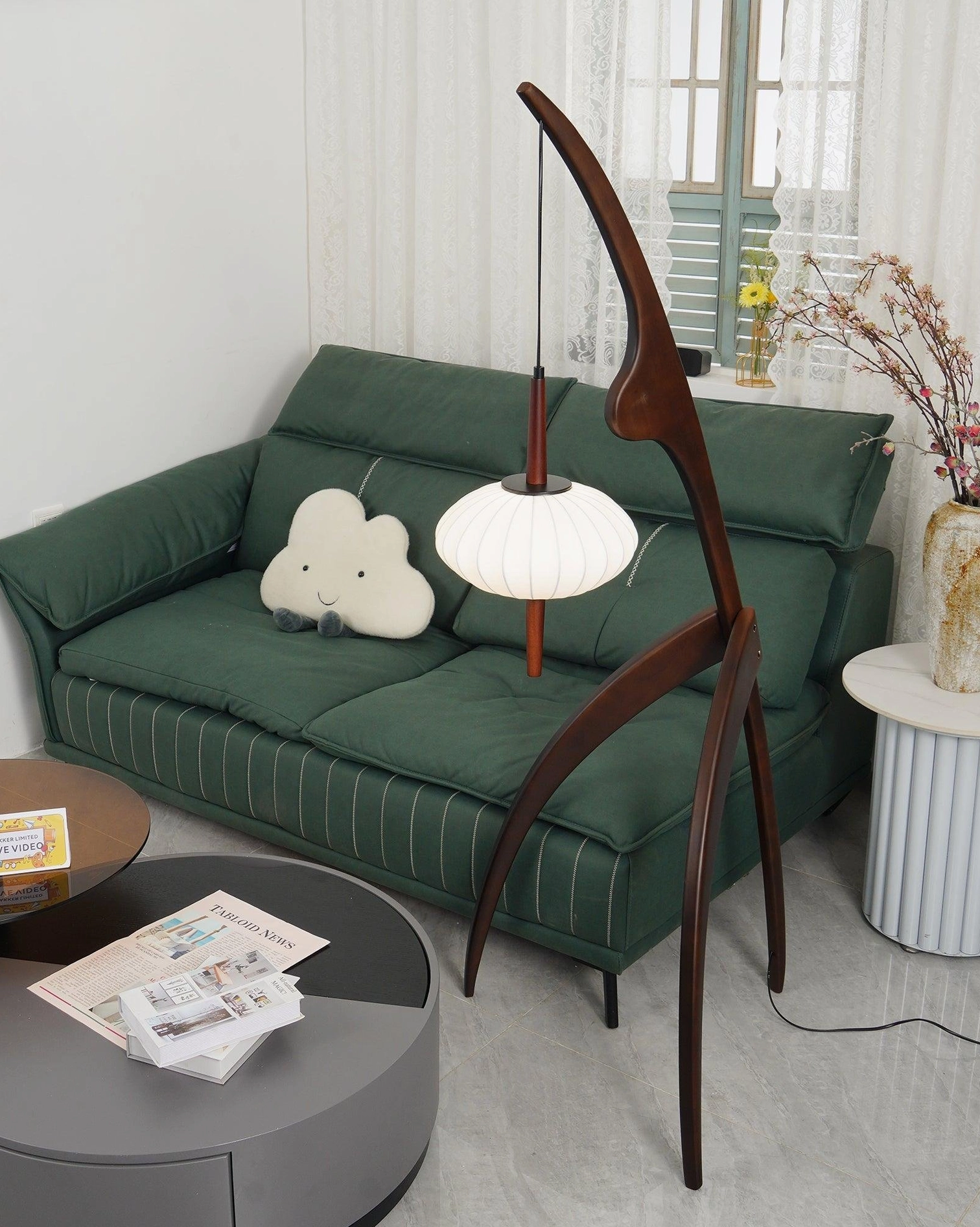 Arc floor lamp with curved wooden design and soft fabric shade studio lighting