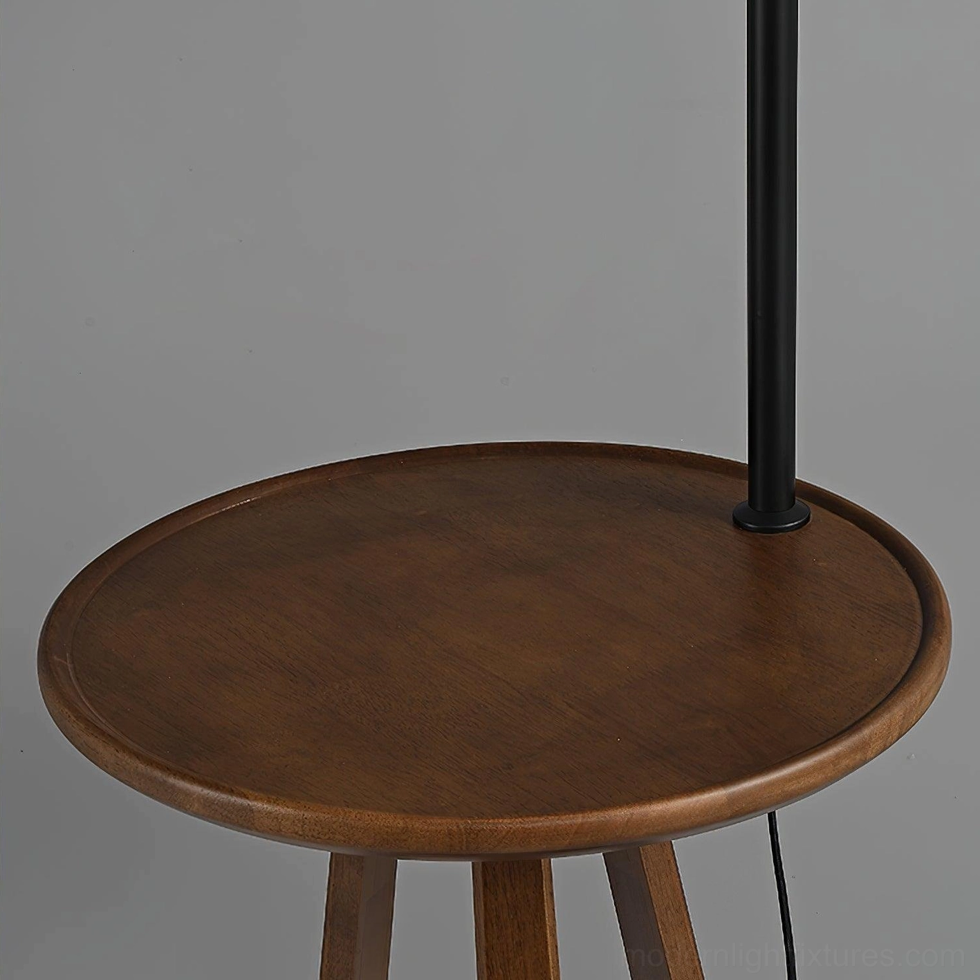 Arc floor lamp with wooden side table, fabric shade detail, metal arc structure, modern lighting design