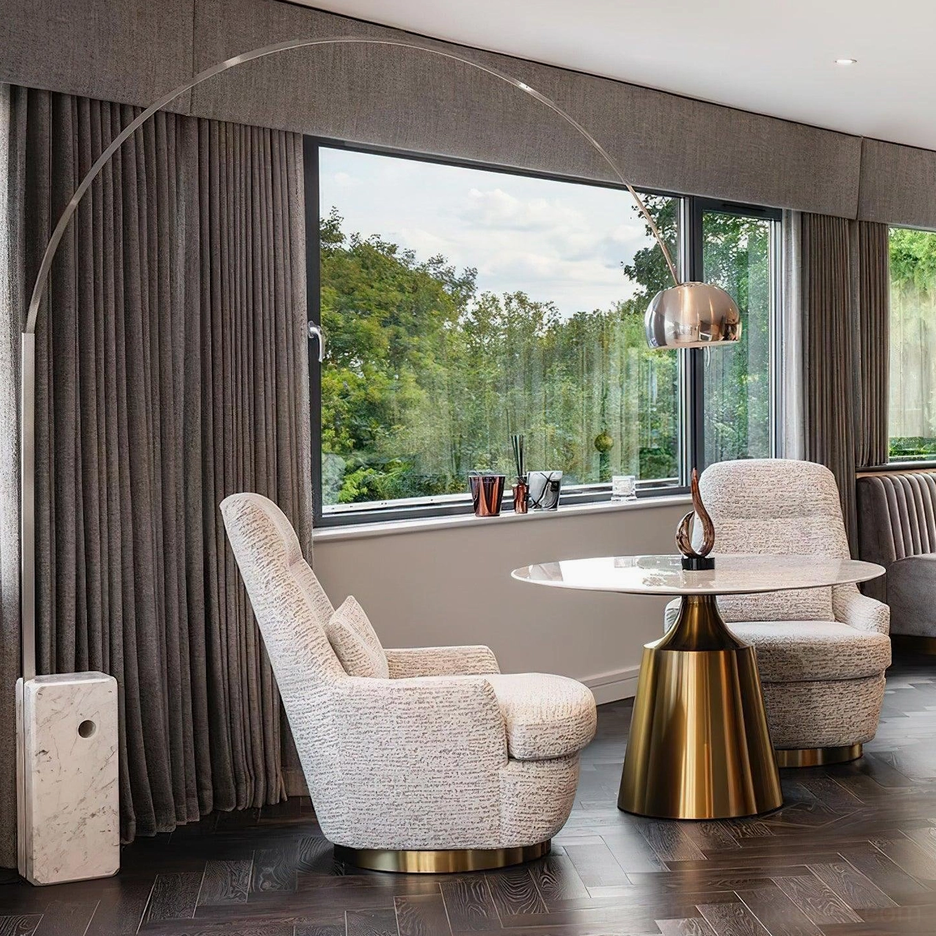 Contemporary arc floor lamp creating focal point in modern apartment living area