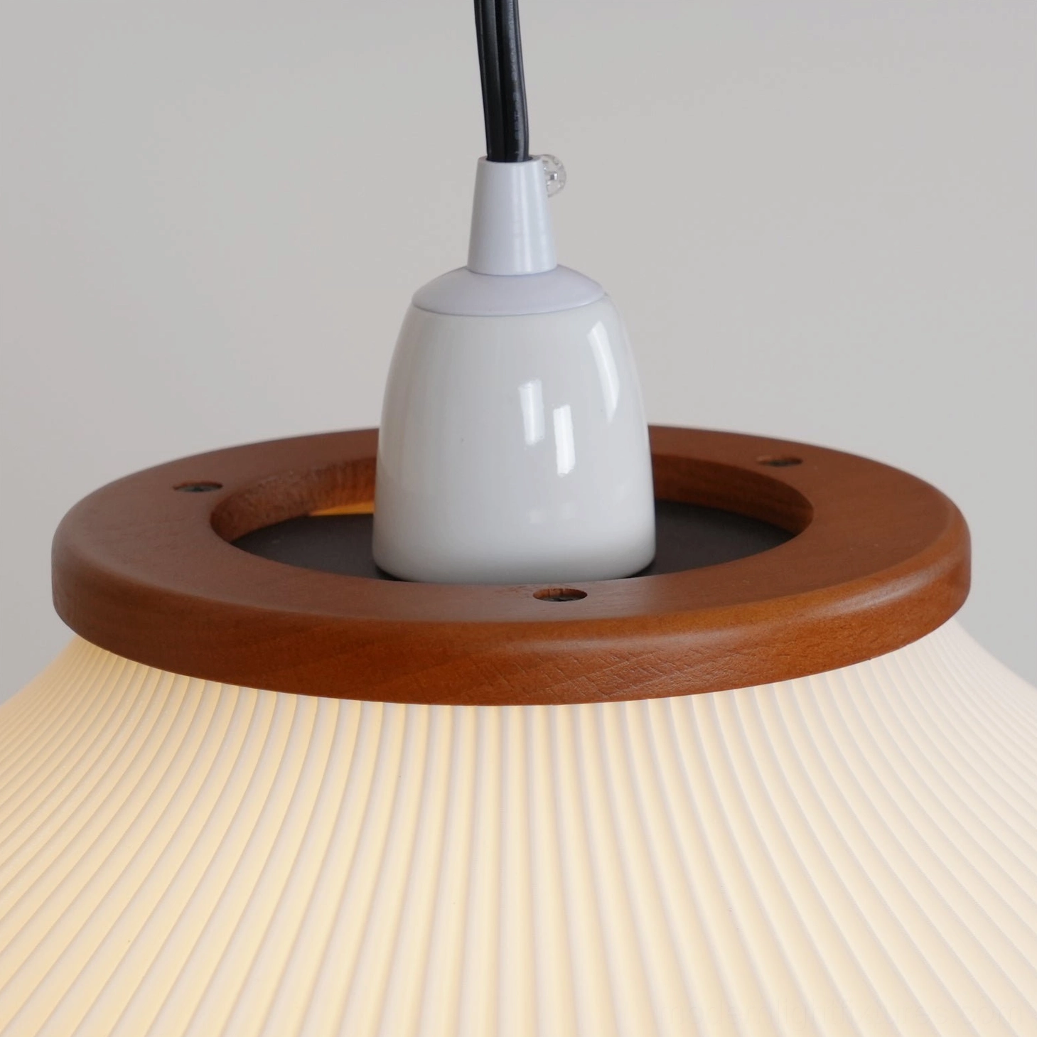 Modern arc floor lamp foot switch detail and cord management, practical functionality