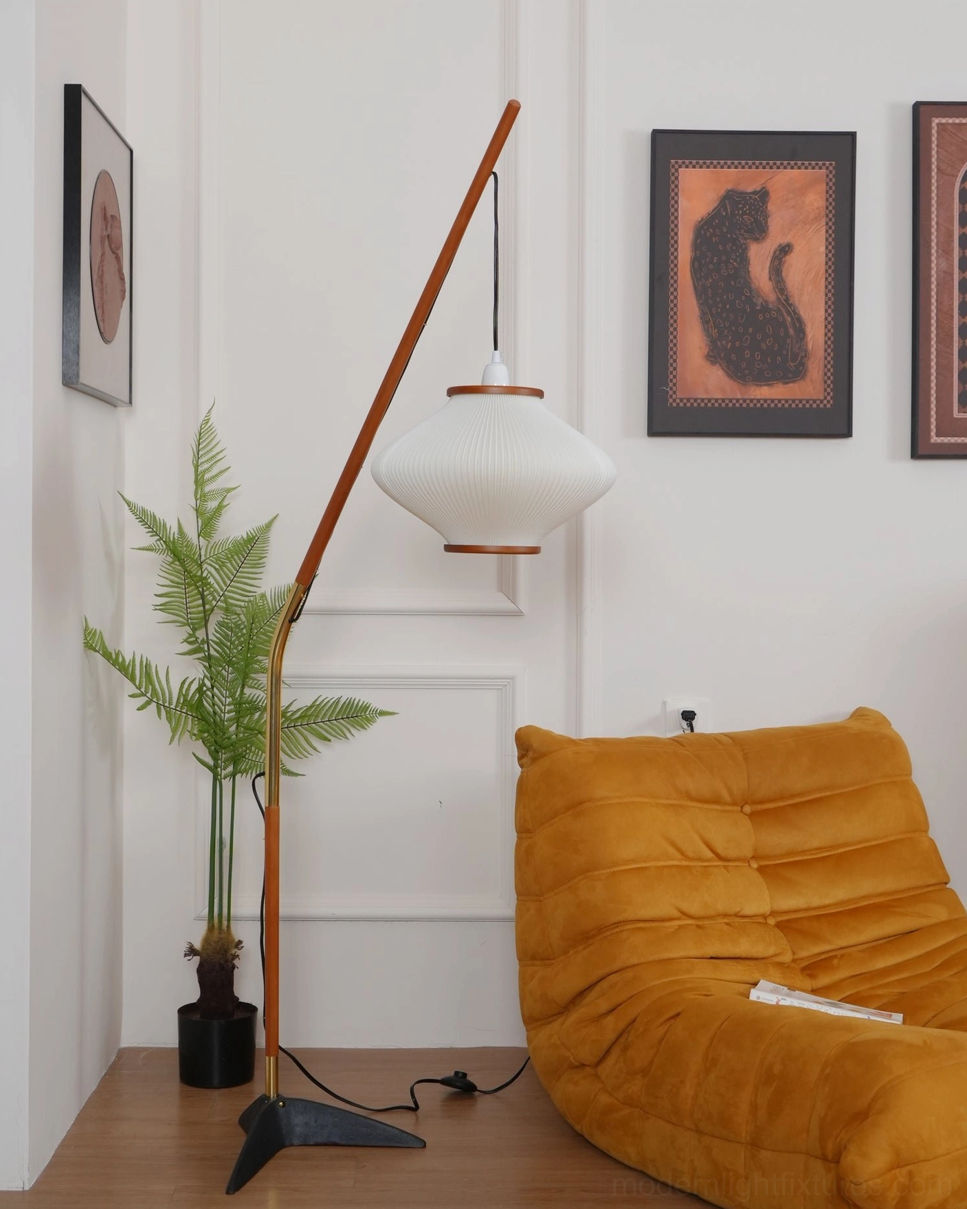 Arc floor lamp in home office setting providing focused task lighting for workspace