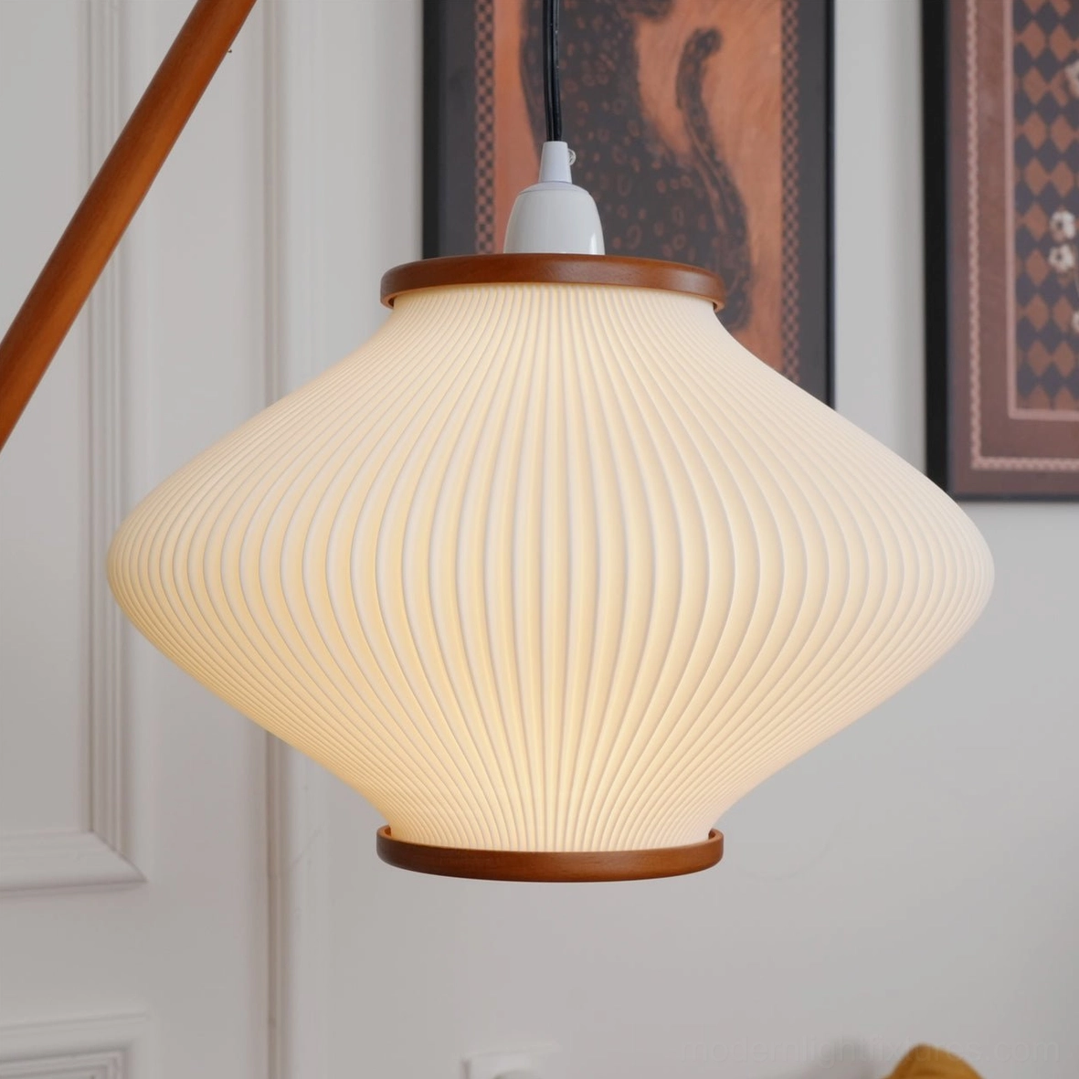 Arc floor lamp styling with home accessories creating cohesive interior design composition