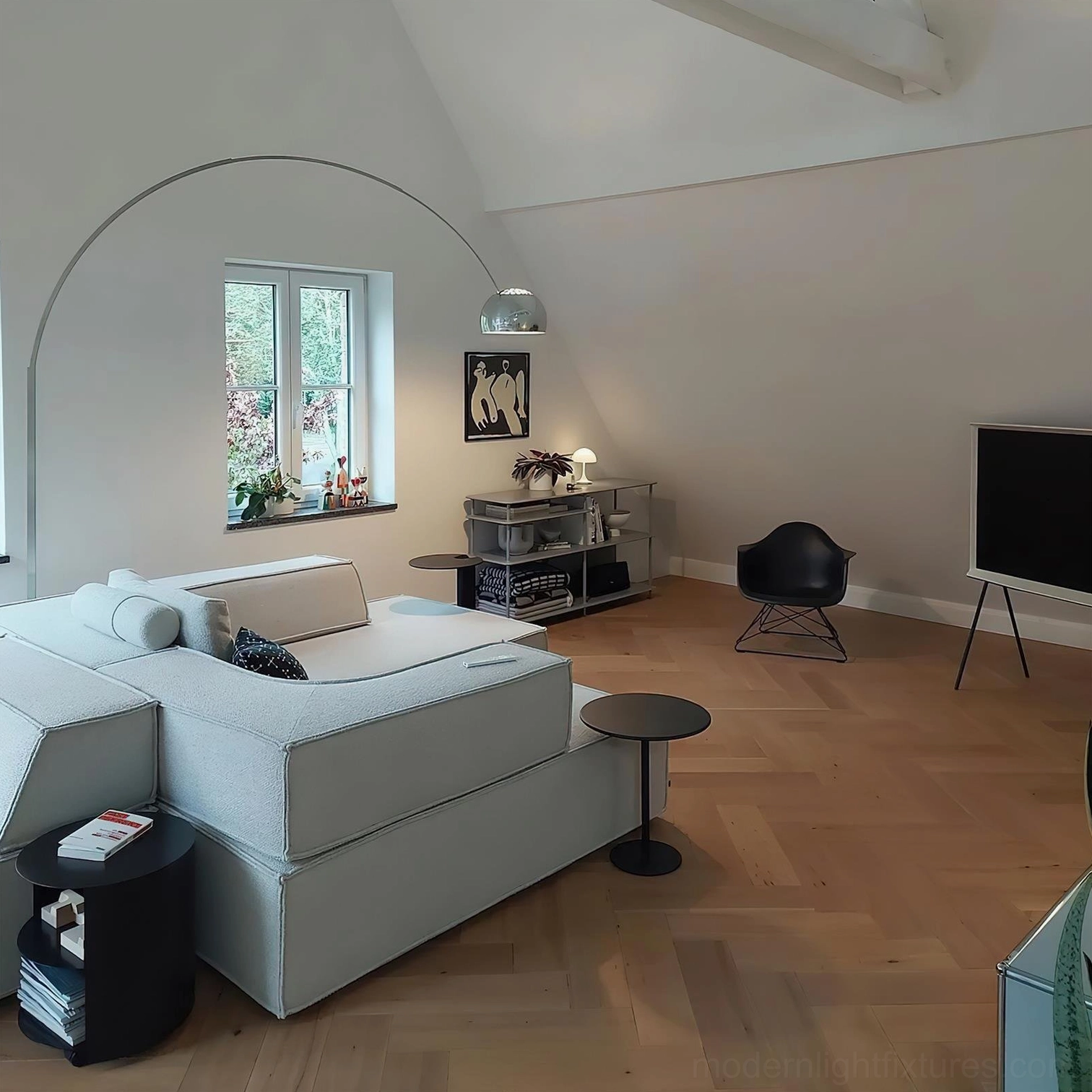 Arc floor lamp with white fabric shade in open concept living space
