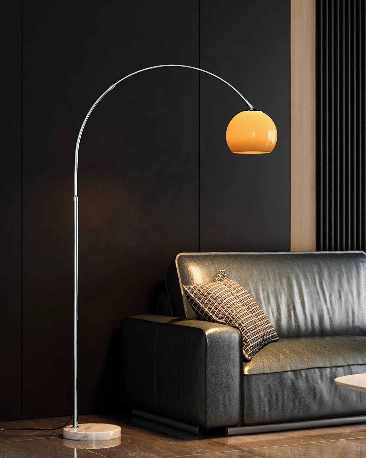 Arc floor lamp with orange spherical shade showing spherical design detail