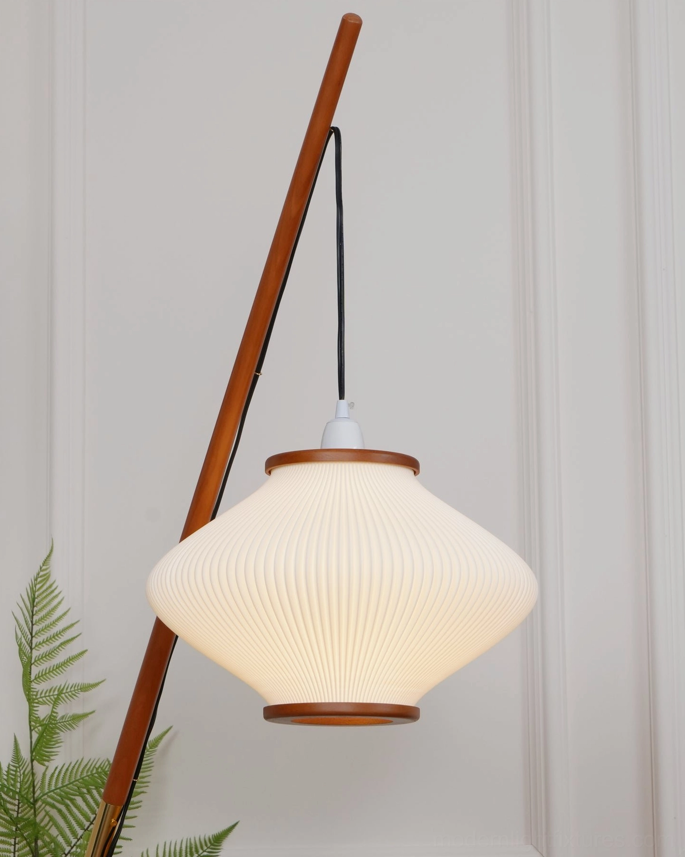 Arc floor lamp in studio photography, product showcase with professional lighting setup