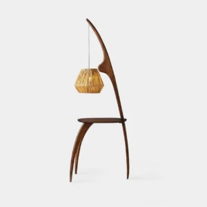 Minimalist arc floor lamp with walnut wood base and woven rattan shade, studio front view
