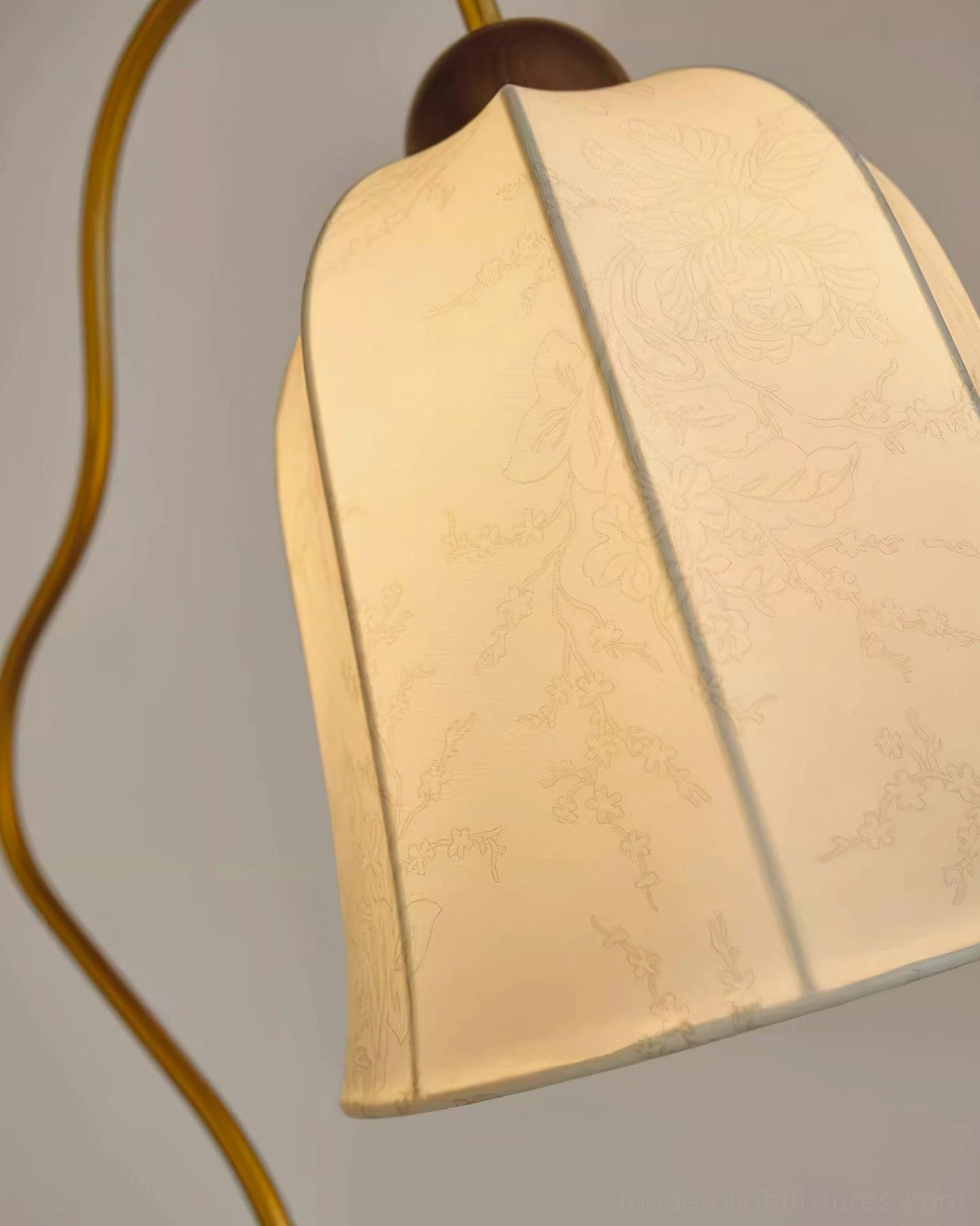 Arc floor lamp in scandinavian interior setting with natural wood tones and minimalist decor style