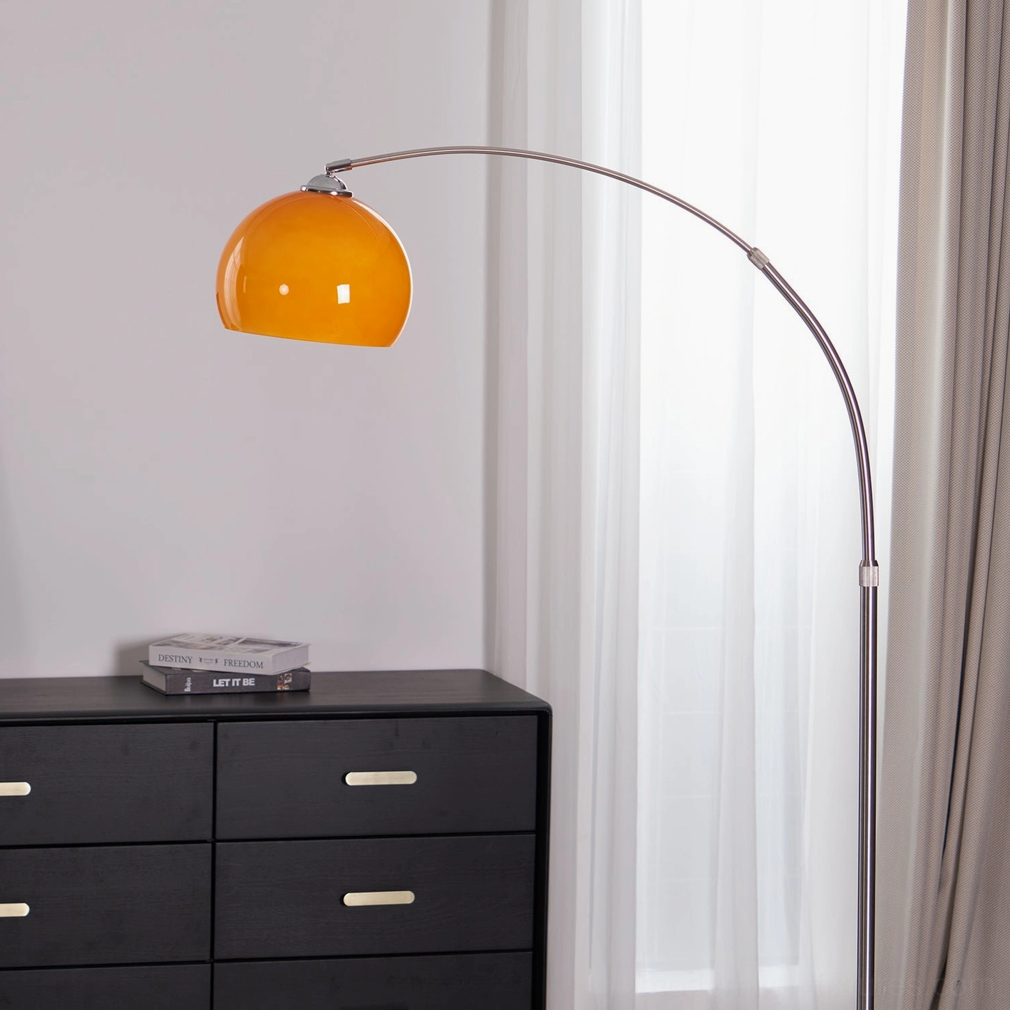 Arc floor lamp sculptural form statement piece minimalist contemporary interiors