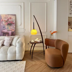 Modern arc floor lamp with integrated side table in French retro living room setting