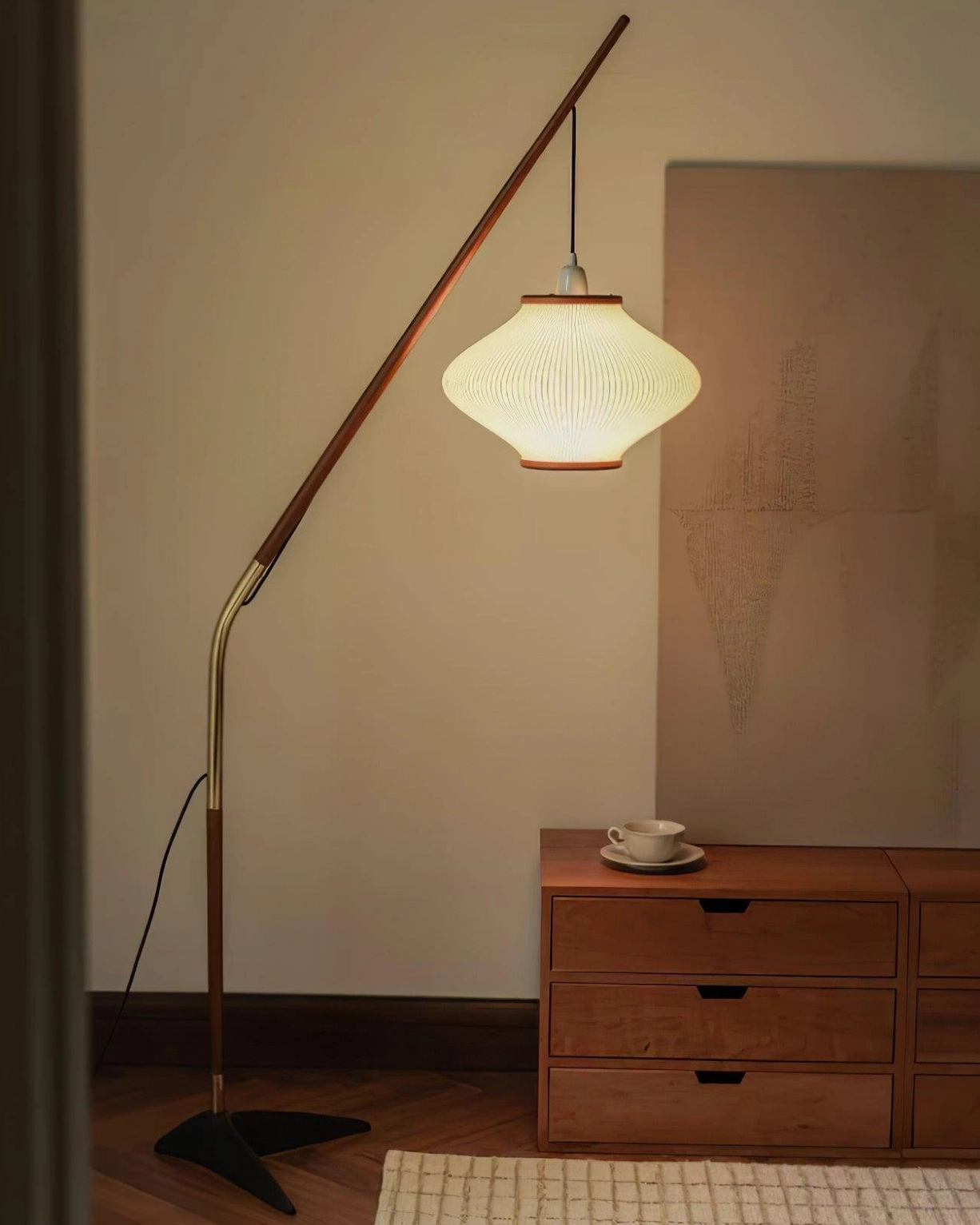 Arc floor lamp with walnut wood pole and brass details, full height display against white background