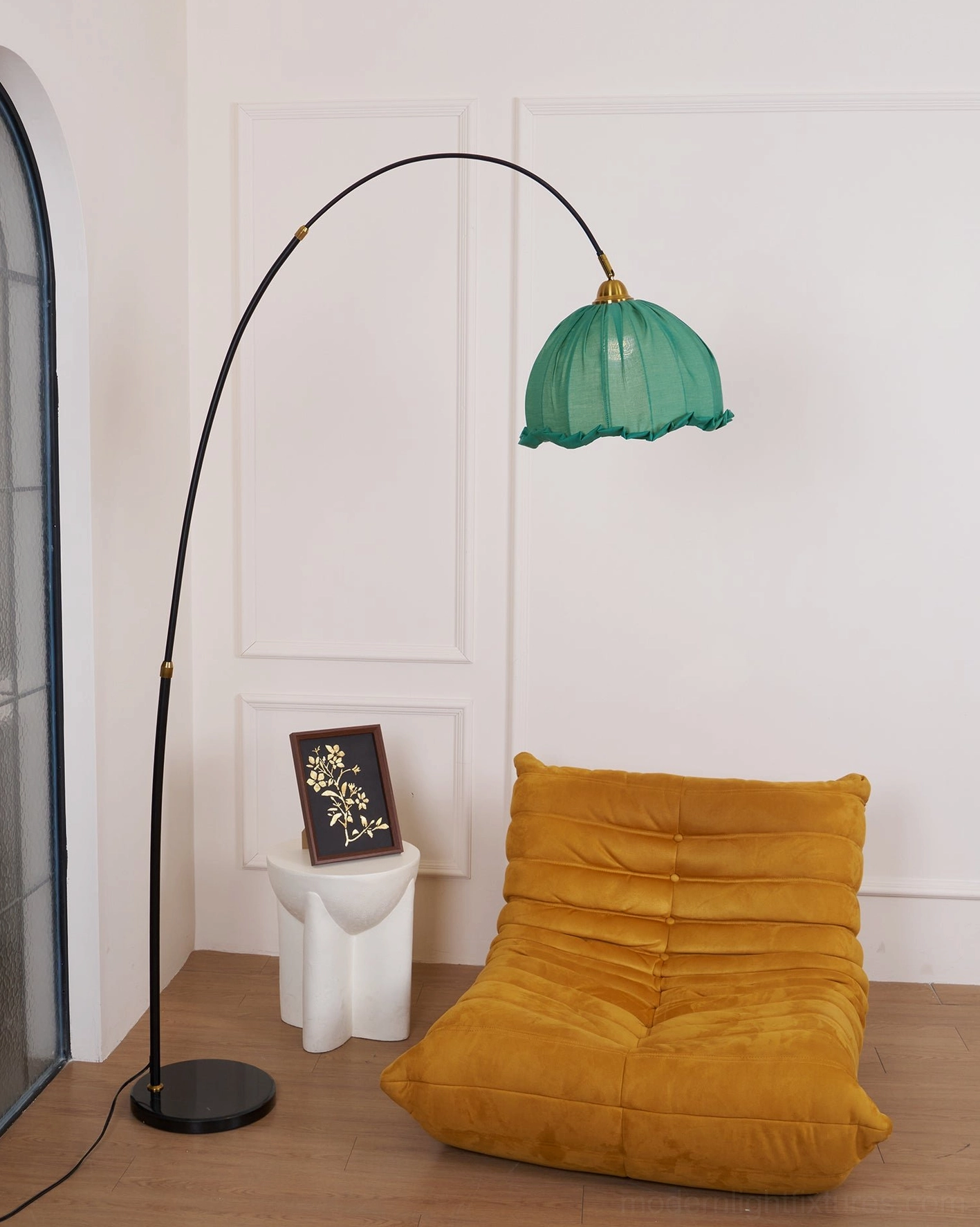 Arc floor lamp elegant curved metal arm architectural element interior design