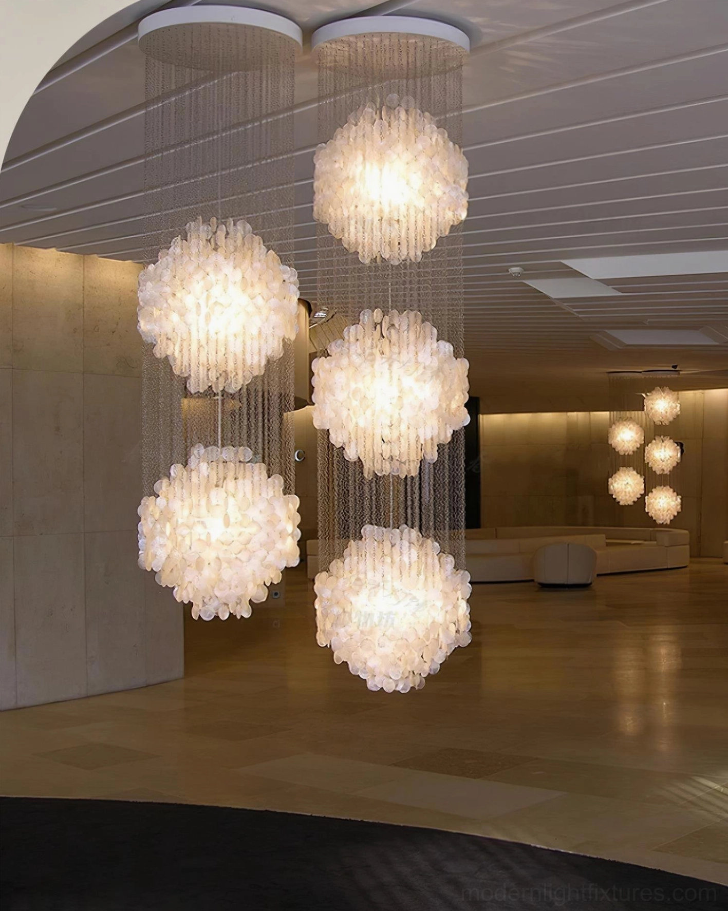 Architectural shell pendant chandelier in contemporary home design showing spatial proportioning and scale